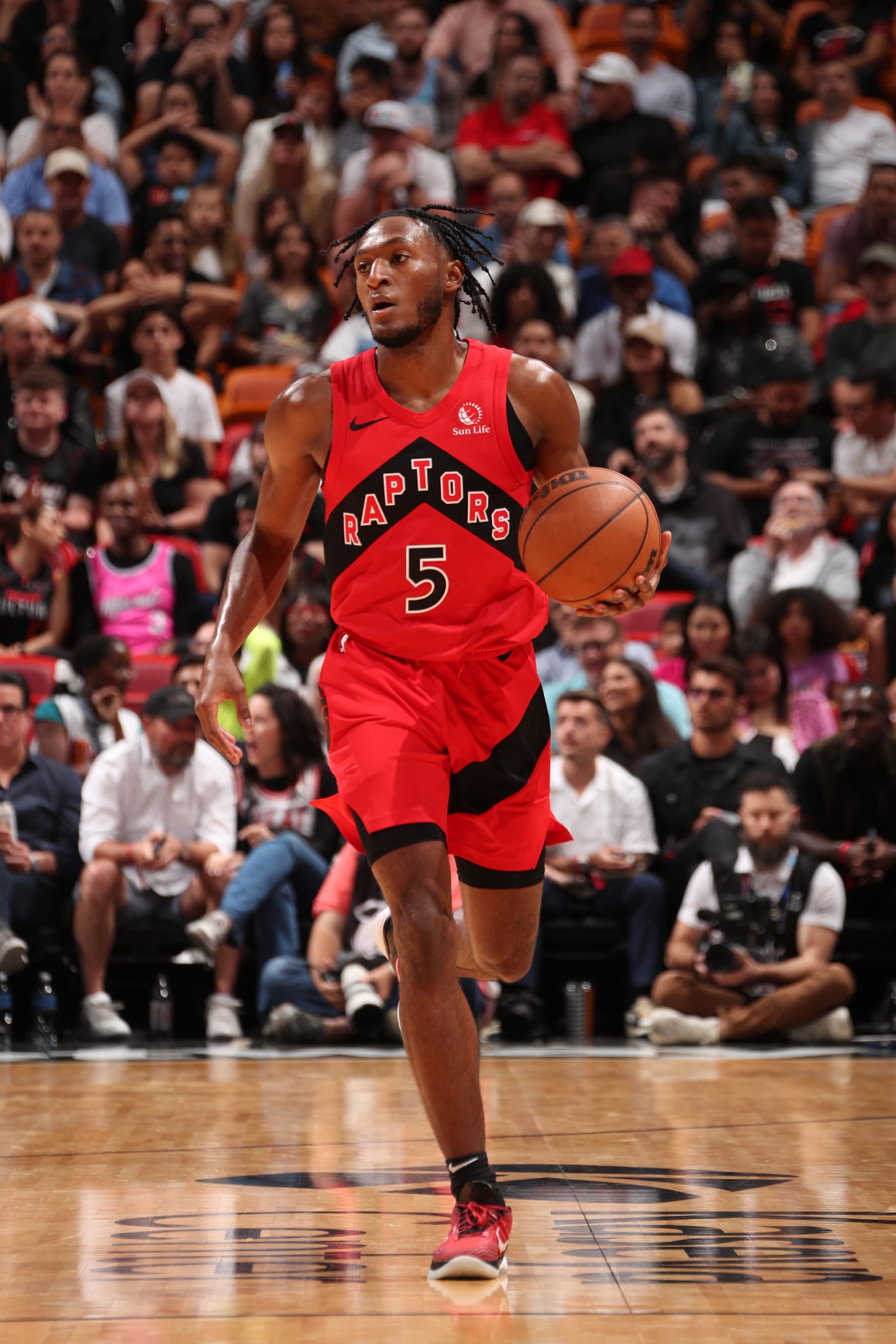 MIAMI, FL - APRIL 12:  Immanuel Quickley #5 of the Toronto Raptors dribbles the ball during the game against the Miami Heat on April 12, 2024 at Kaseya Center in Miami, Florida. NOTE TO USER: User expressly acknowledges and agrees that, by downloading and or using this Photograph, user is consenting to the terms and conditions of the Getty Images License Agreement. Mandatory Copyright Notice: Copyright 2024 NBAE (Photo by Issac Baldizon/NBAE via Getty Images)