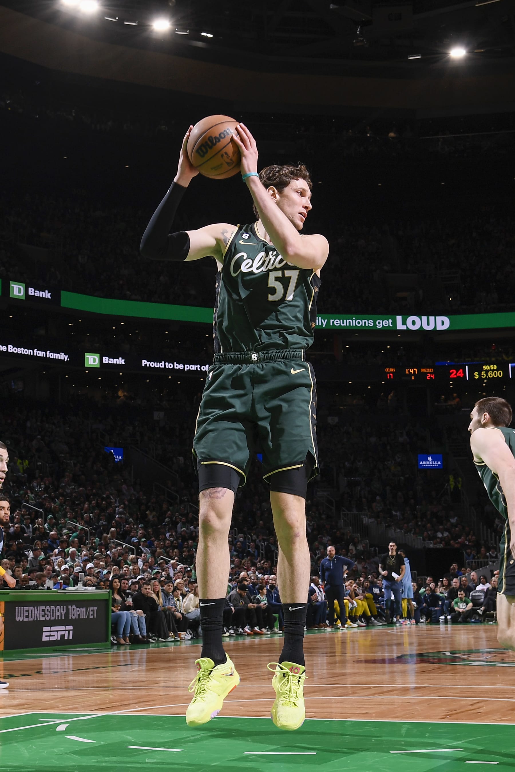 BOSTON, MA - FEBUARY 12:  Mike Muscala #57 of the Boston Celtics grabs the rebound during the game on Febuary 12, 2023 at the TD Garden in Boston, Massachusetts.  NOTE TO USER: User expressly acknowledges and agrees that, by downloading and or using this photograph, User is consenting to the terms and conditions of the Getty Images License Agreement. Mandatory Copyright Notice: Copyright 2023 NBAE  (Photo by Brian Babineau/NBAE via Getty Images)