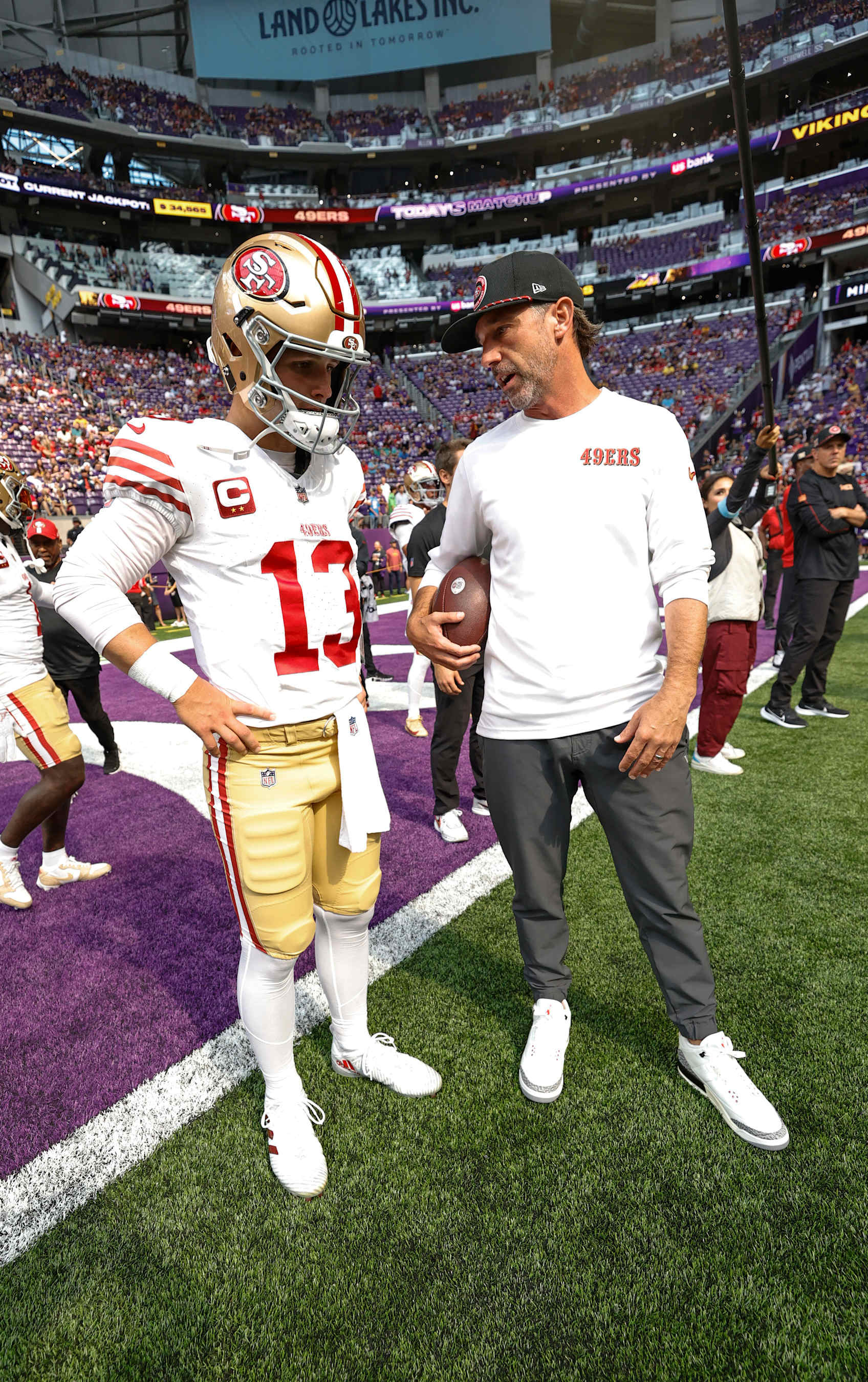 MINNEAPOLIS, MN - SEPTEMBER 15: Brock Purdy #13 and Head Coach Kyle Shanahan of the San Francisco 49ers before the game against the Minnesota Vikings at U.S. Bank Stadium on September 15, 2024 in Minneapolis, Minnesota. The Vikings defeated the 49ers 23-17. (Photo by Michael Zagaris/San Francisco 49ers/Getty Images)