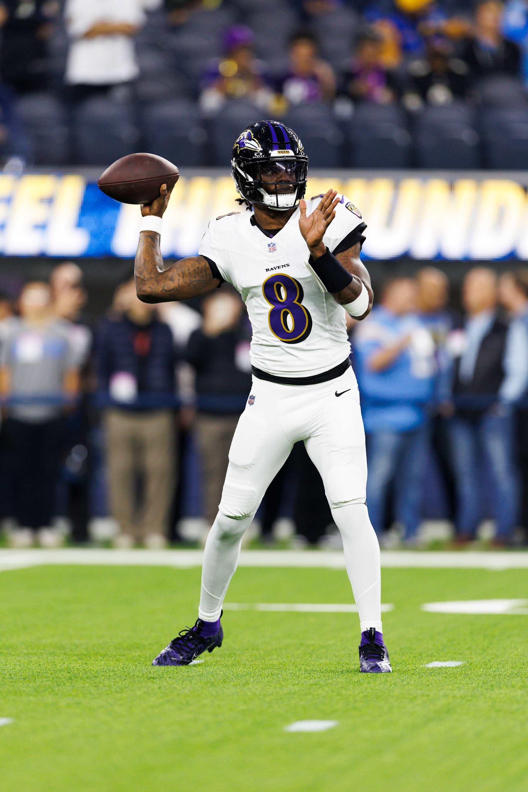 INGLEWOOD, CALIFORNIA - NOVEMBER 25: Lamar Jackson #8 of the Baltimore Ravens throws before a game against the Los Angeles Chargers at SoFi Stadium on November 25, 2024 in Inglewood, California. (Photo by Ric Tapia/Getty Images)