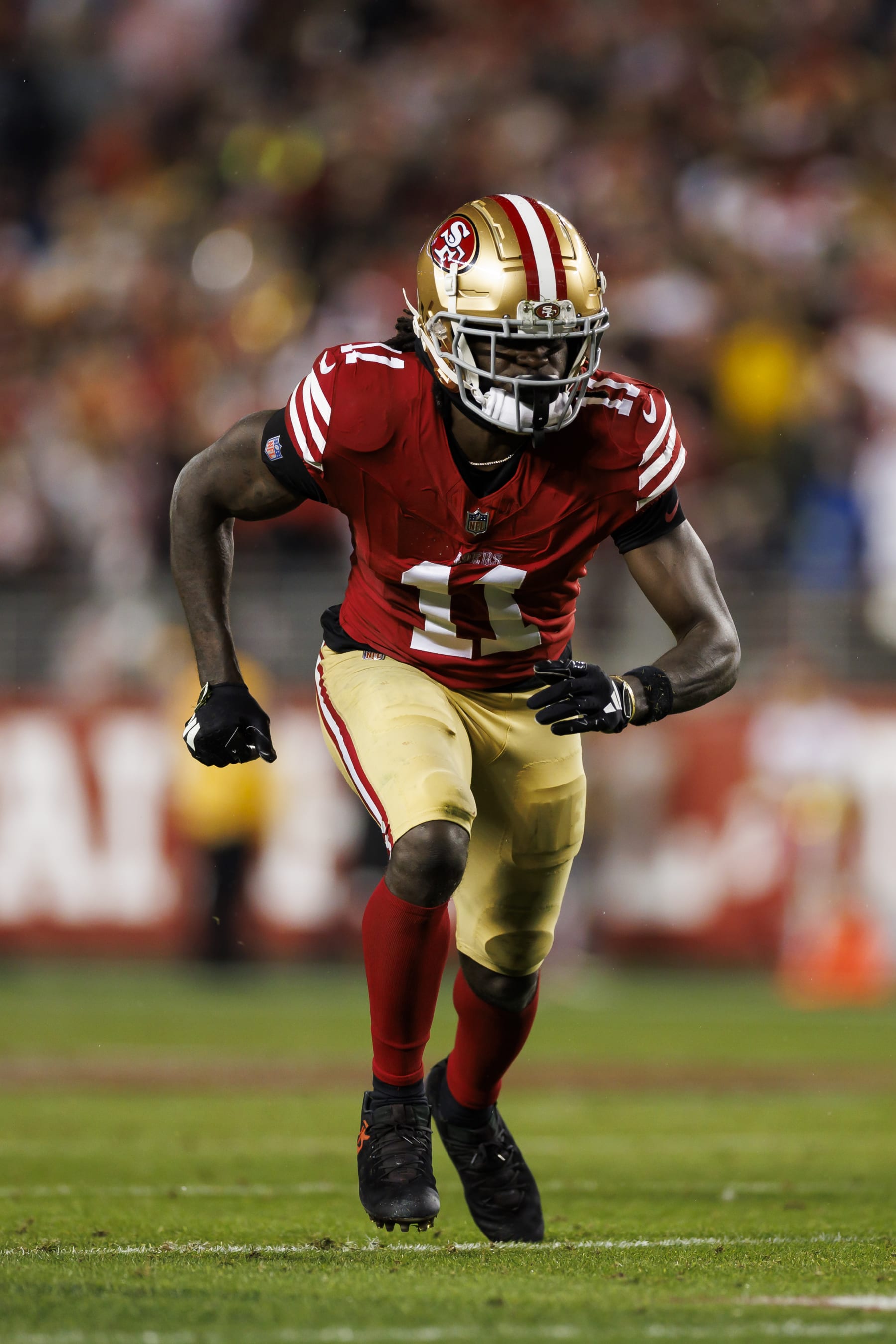 SANTA CLARA, CALIFORNIA - JANUARY 20: Brandon Aiyuk #11 of the San Francisco 49ers runs a route during an NFC divisional round playoff football game against the Green Bay Packers at Levi's Stadium on January 20, 2024 in Santa Clara, California. (Photo by Ryan Kang/Getty Images)