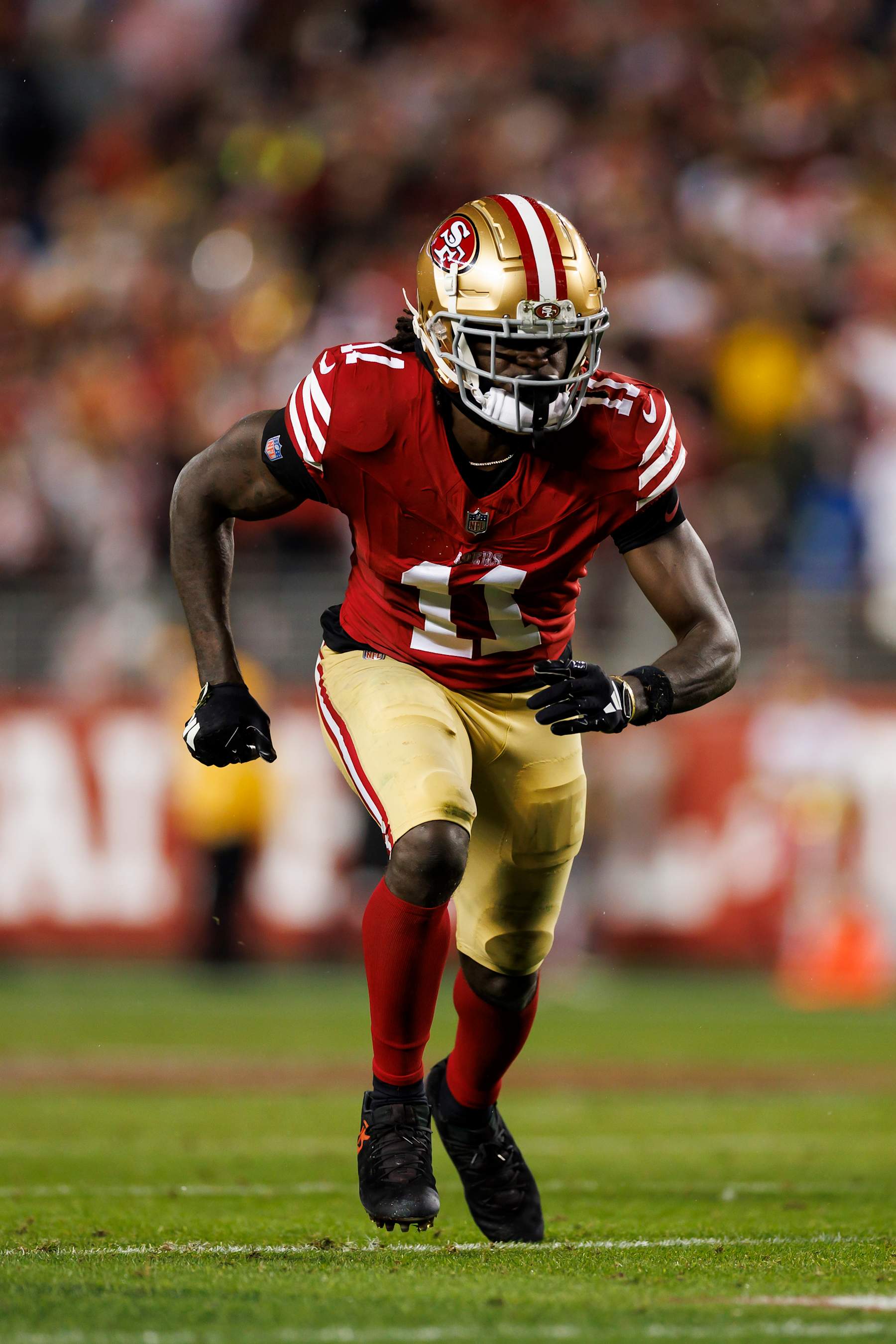 SANTA CLARA, CALIFORNIA - JANUARY 20: Brandon Aiyuk #11 of the San Francisco 49ers runs a route during an NFC divisional round playoff football game against the Green Bay Packers at Levi's Stadium on January 20, 2024 in Santa Clara, California. (Photo by Ryan Kang/Getty Images)