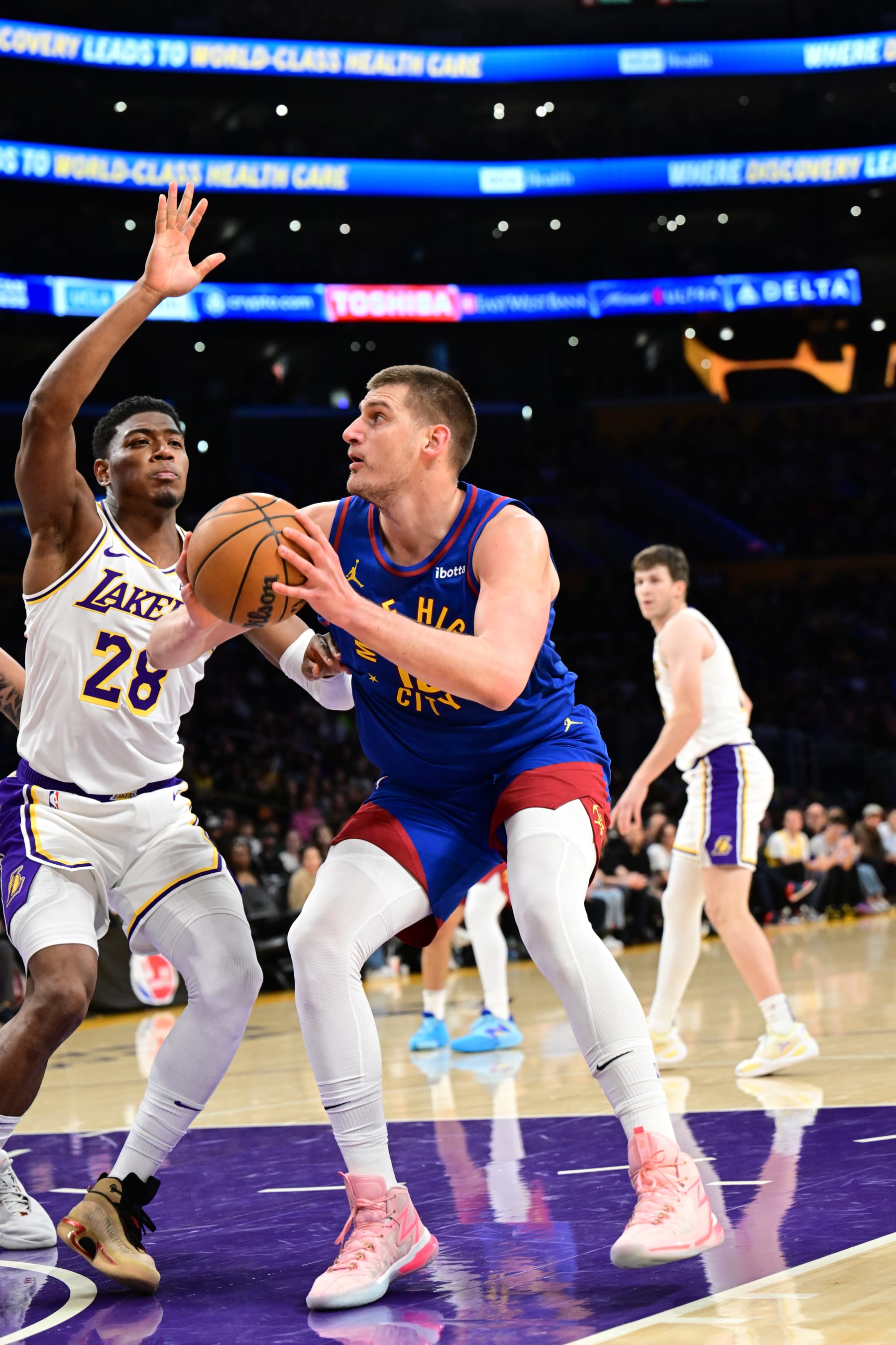 LOS ANGELES, CA - MARCH 2: Nikola Jokic #15 of the Denver Nuggets drives to the basket during the game against the Los Angeles Lakers on March 2, 2024 at Crypto.Com Arena in Los Angeles, California. NOTE TO USER: User expressly acknowledges and agrees that, by downloading and/or using this Photograph, user is consenting to the terms and conditions of the Getty Images License Agreement. Mandatory Copyright Notice: Copyright 2024 NBAE (Photo by Adam Pantozzi/NBAE via Getty Images)