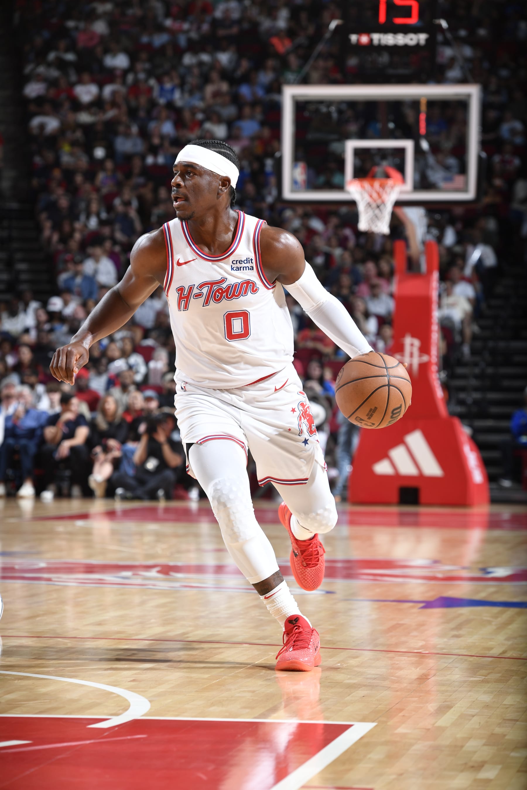 HOUSTON, TX - MARCH 31: Aaron Holiday #0 of the Houston Rockets handles the ball during the game against the Dallas Mavericks on March 31, 2024 at the Toyota Center in Houston, Texas. NOTE TO USER: User expressly acknowledges and agrees that, by downloading and or using this photograph, User is consenting to the terms and conditions of the Getty Images License Agreement. Mandatory Copyright Notice: Copyright 2024 NBAE (Photo by Logan Riely/NBAE via Getty Images)