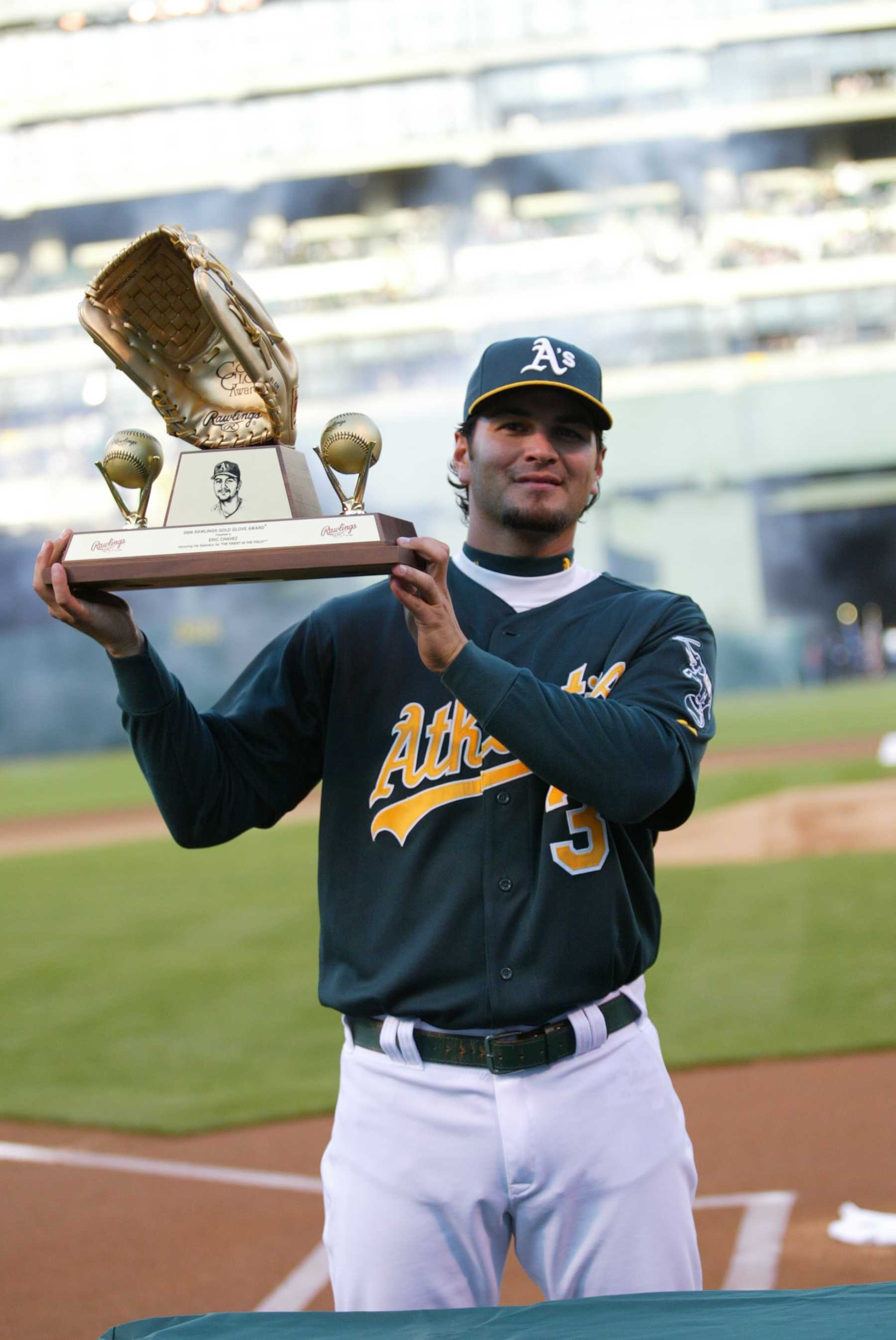 OAKLAND, CA - APRIL 9:  Eric Chavez of the Oakland Athletics is honored with his sixth consecutive Gold Glove before the game against the Chicago White Sox on MLB Opening Night at the McAfee Coliseum in Oakland, California on April 9, 2007.  The White Sox defeated the Athletics 4-1.  (Photo by Michael Zagaris/MLB Photos via Getty Images)