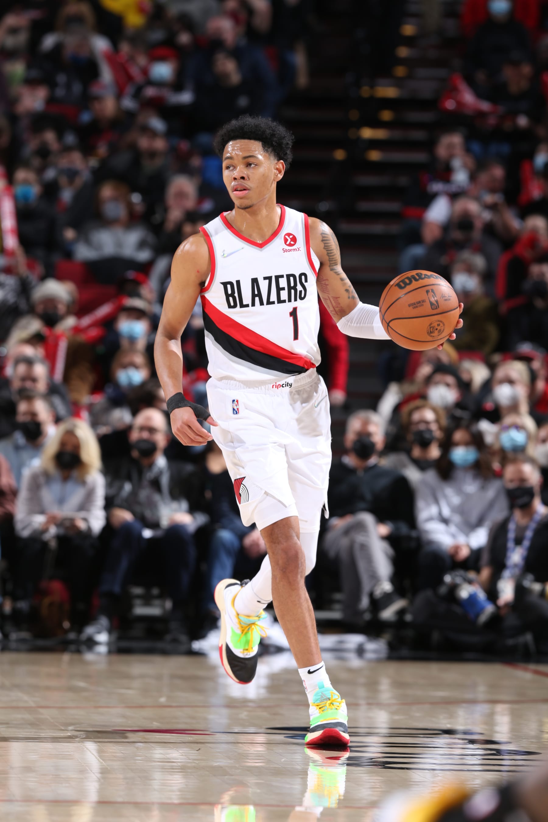 PORTLAND, OR - FEBRUARY 8:  Anfernee Simons #1 of the Portland Trail Blazers dribbles the ball during the game against the Orlando Magic on February 8, 2022 at the Moda Center Arena in Portland, Oregon. NOTE TO USER: User expressly acknowledges and agrees that, by downloading and or using this photograph, user is consenting to the terms and conditions of the Getty Images License Agreement. Mandatory Copyright Notice: Copyright 2022 NBAE (Photo by Sam Forencich/NBAE via Getty Images)