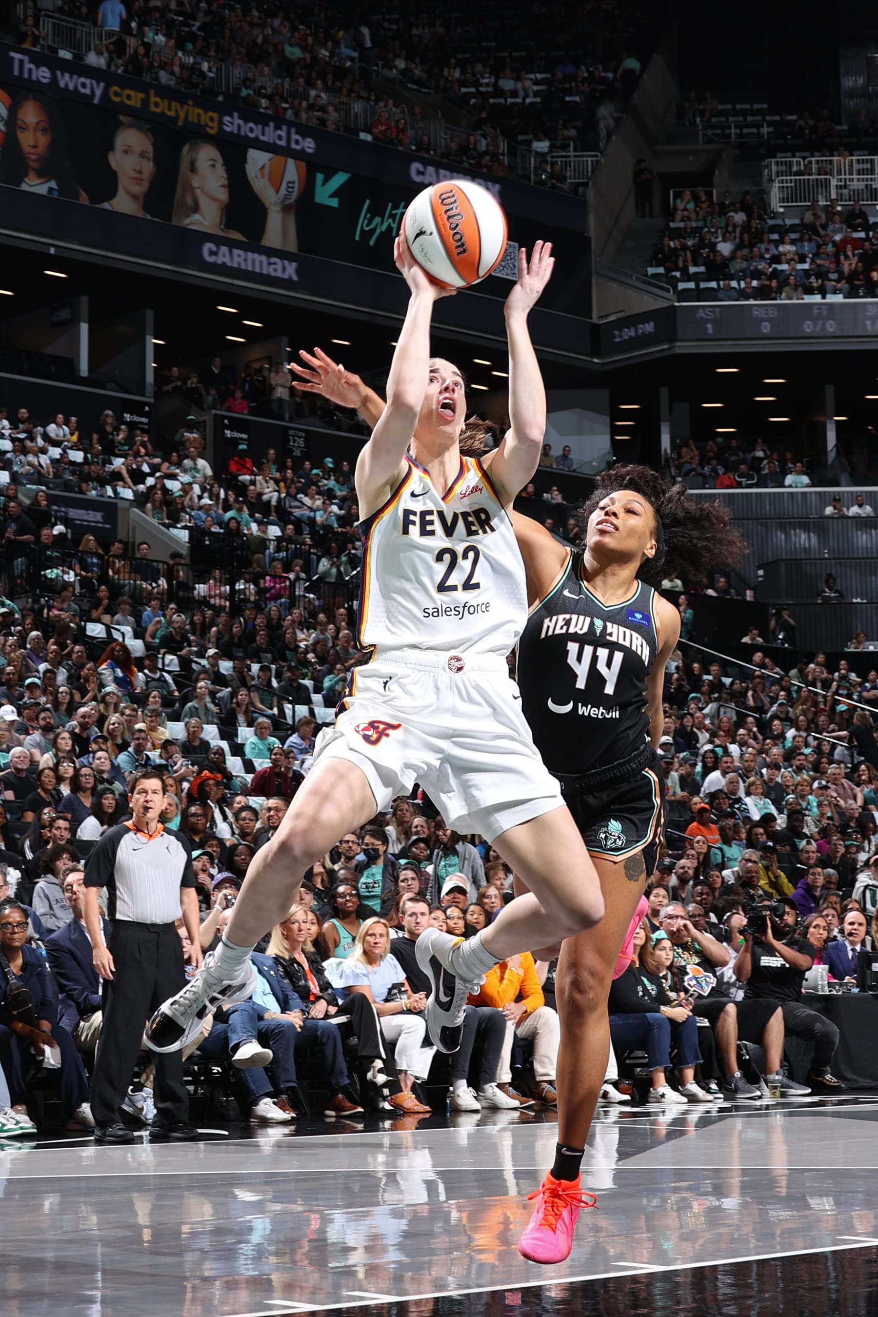 BROOKLYN, NY - MAY 18: Caitlin Clark #22 of the Indiana Fever drives to the basket during the game against the New York Liberty on May 18, 2024 at Barclays Center in Brooklyn, New York. NOTE TO USER: User expressly acknowledges and agrees that, by downloading and or using this Photograph, user is consenting to the terms and conditions of the Getty Images License Agreement. Mandatory Copyright Notice: Copyright 2024 NBAE (Photo by Stephen Gosling/NBAE via Getty Images)