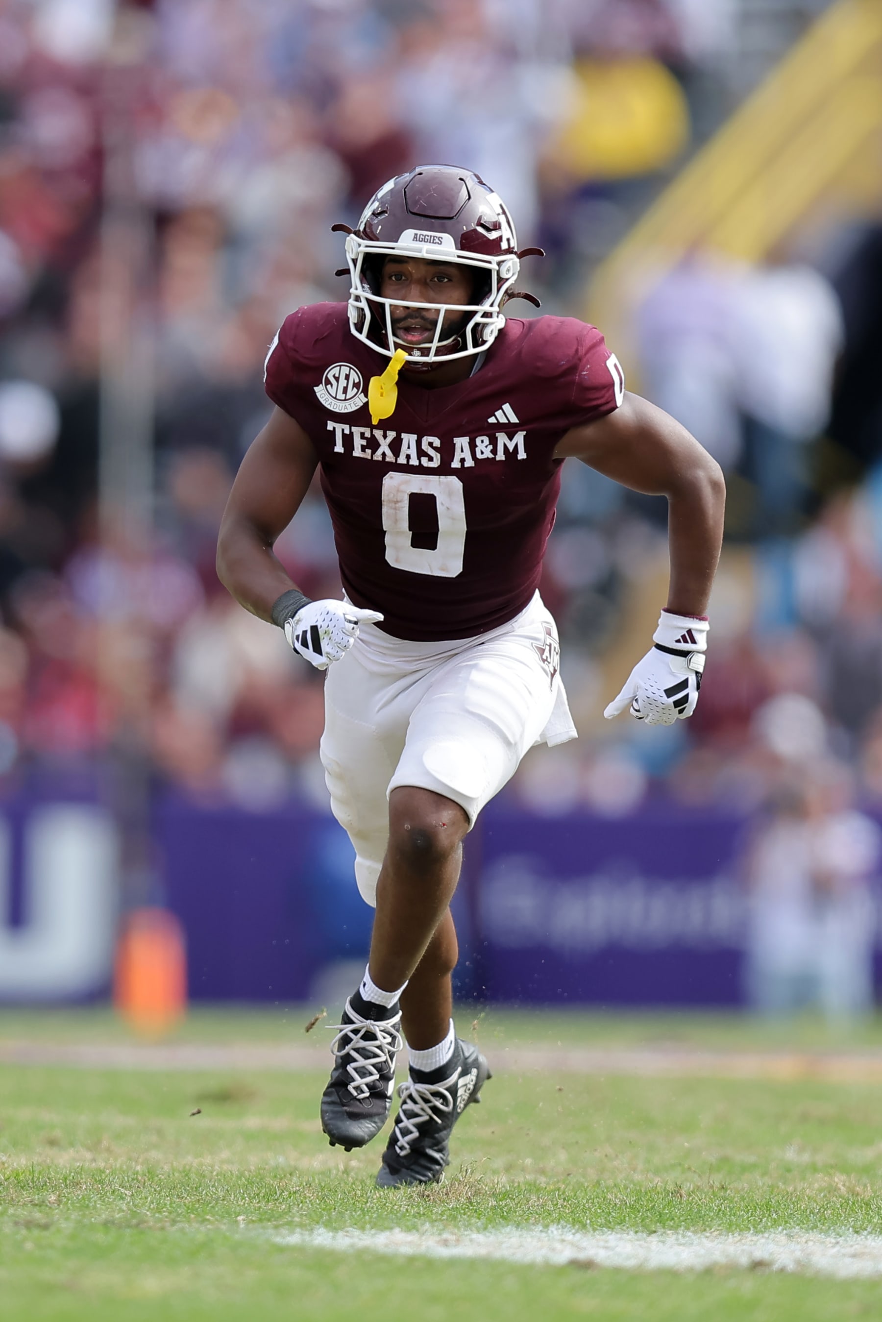 BATON ROUGE, LOUISIANA - NOVEMBER 25: Ainias Smith #0 of the Texas A&M Aggies in action against the LSU Tigers during a game at Tiger Stadium on November 25, 2023 in Baton Rouge, Louisiana. (Photo by Jonathan Bachman/Getty Images)