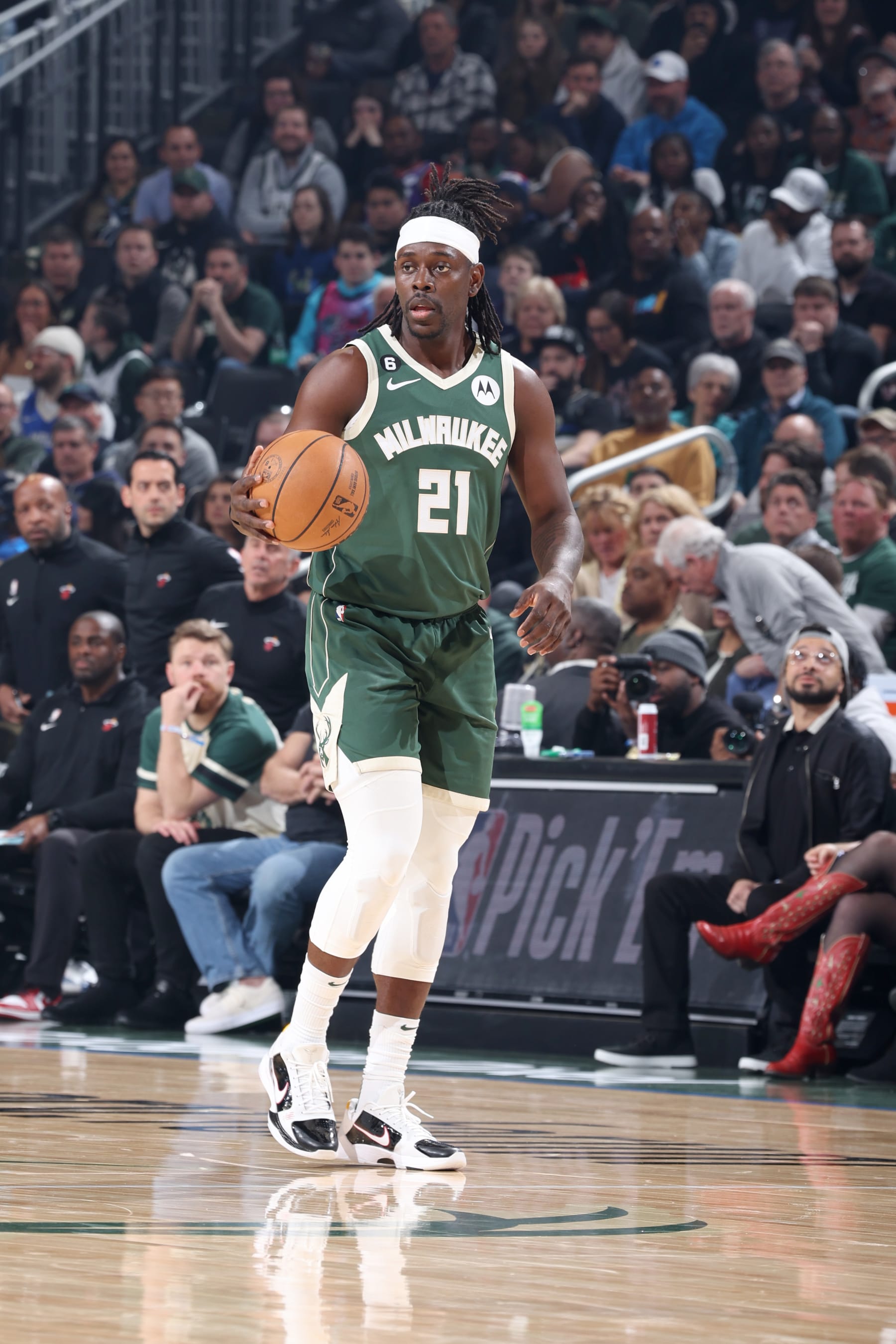 MILWAUKEE, WI - APRIL 26: Jrue Holiday #21 of the Milwaukee Bucks dribbles the ball against the Miami Heat during Round 1 Game 5 of the 2023 NBA Playoffs on April 26, 2023 at the Fiserv Forum Center in Milwaukee, Wisconsin. NOTE TO USER: User expressly acknowledges and agrees that, by downloading and or using this Photograph, user is consenting to the terms and conditions of the Getty Images License Agreement. Mandatory Copyright Notice: Copyright 2023 NBAE (Photo by Jeff Haynes/NBAE via Getty Images).