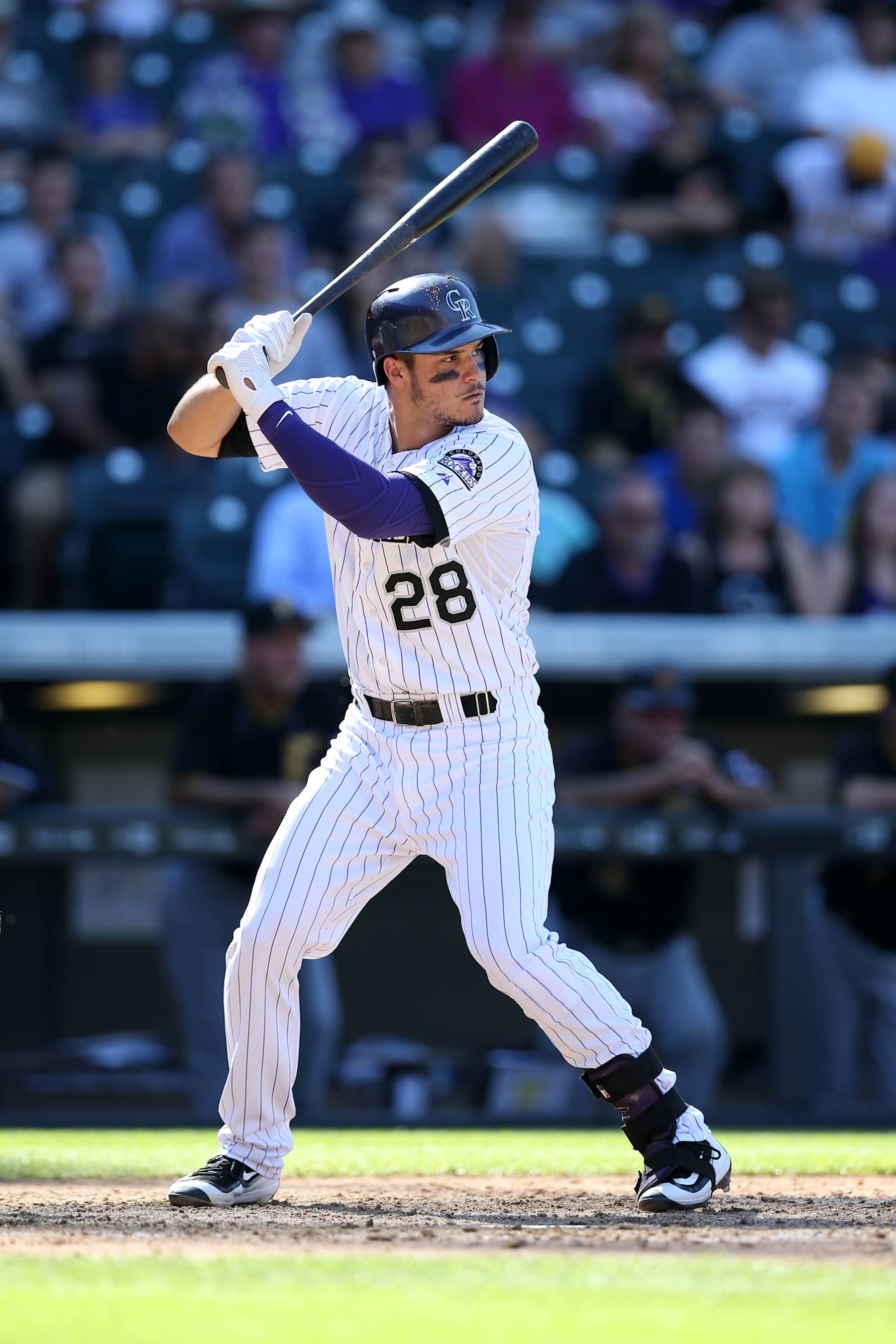 DENVER, CO - SEPTEMBER 24:  Nolan Arenado #28 of the Colorado Rockies bats during the game against the Pittsburgh Pirates at Coors Field on September 24, 2015 in Denver, Colorado.  The Pirates defeated the Rockies 5-4.  (Photo by Rob Leiter/MLB Photos via Getty Images)