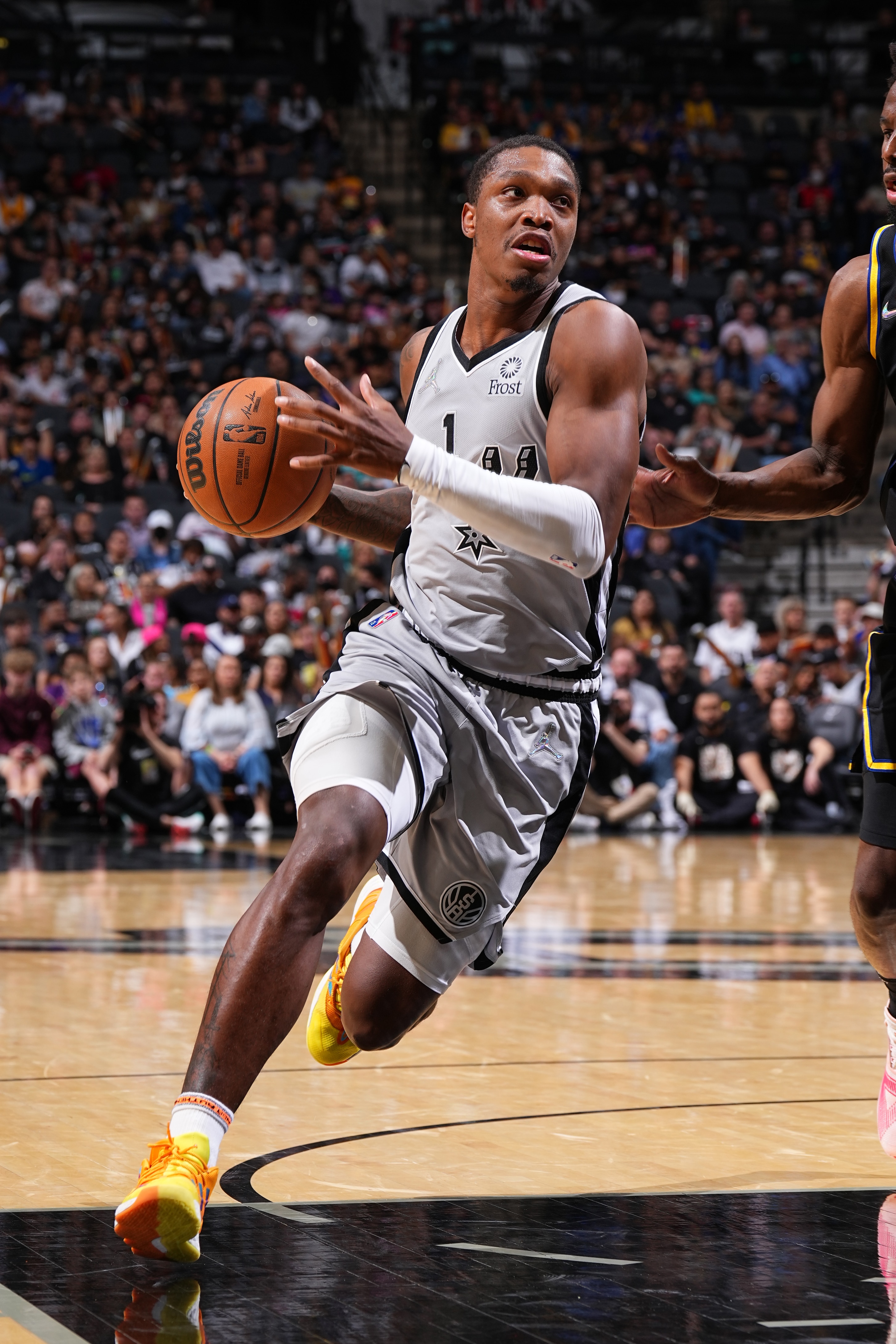 SAN ANTONIO, TX -APRIL 9: Lonnie Walker IV #1 of the San Antonio Spurs drives to the basket during the game against the Golden State Warriors on April 9, 2022 at the AT&T Center in San Antonio, Texas. NOTE TO USER: User expressly acknowledges and agrees that, by downloading and or using this photograph, user is consenting to the terms and conditions of the Getty Images License Agreement. Mandatory Copyright Notice: Copyright 2022 NBAE (Photos by Garrett Ellwood/NBAE via Getty Images)
