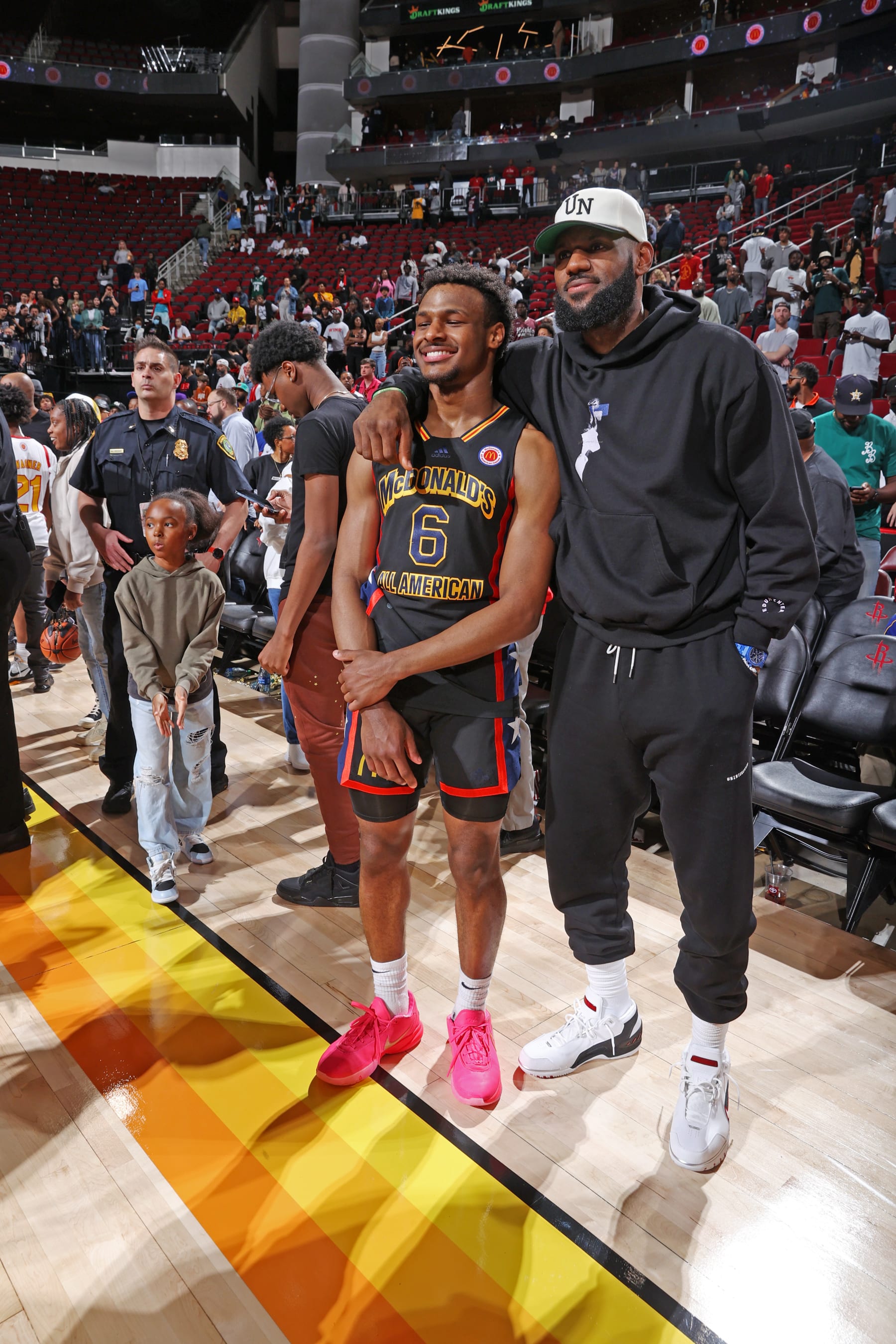 HOUSTON, TX - MARCH 28: McDonalds High School All American Bronny James (6) talks with his father LeBron James after the 2023 McDonalds High School All American Boys Game at Toyota Center. (Photo by Brian Spurlock/Icon Sportswire via Getty Images