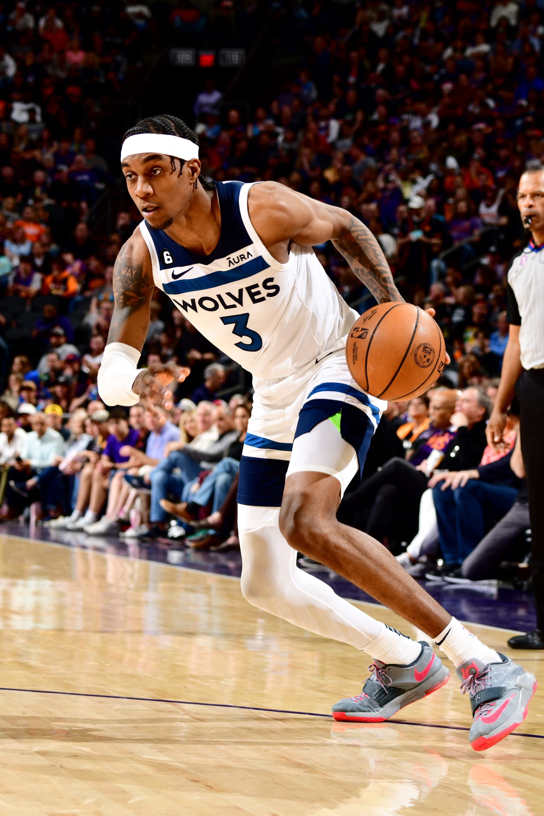 PHOENIX, AZ - MARCH 29: Jaden McDaniels #3 of the Minnesota Timberwolves dribbles the ball during the game against the Phoenix Suns on March 29, 2022 at Footprint Center in Phoenix, Arizona. NOTE TO USER: User expressly acknowledges and agrees that, by downloading and or using this photograph, user is consenting to the terms and conditions of the Getty Images License Agreement. Mandatory Copyright Notice: Copyright 2022 NBAE (Photo by Barry Gossage/NBAE via Getty Images)