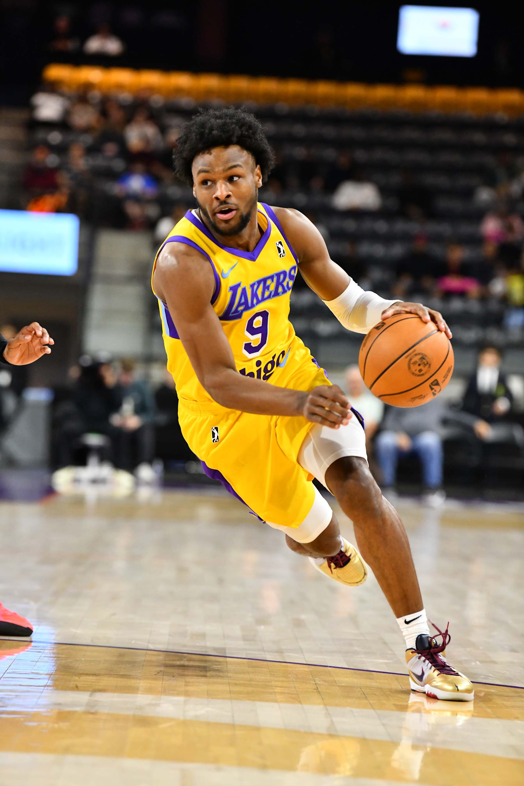 TEMPE, AZ - Bronny James #9 of the South Bay Lakers dribbles the ball against the Valley Suns on December 13, 2024, at Mullett Arena in Tempe, Arizona. NOTE TO USER: User expressly acknowledges and agrees that, by downloading and or using this photograph, user is consenting to the terms and conditions of the Getty Images License Agreement. Mandatory Copyright Notice: Copyright 2024 NBAE (Photo by Barry Gossage / NBAE via Getty Images)