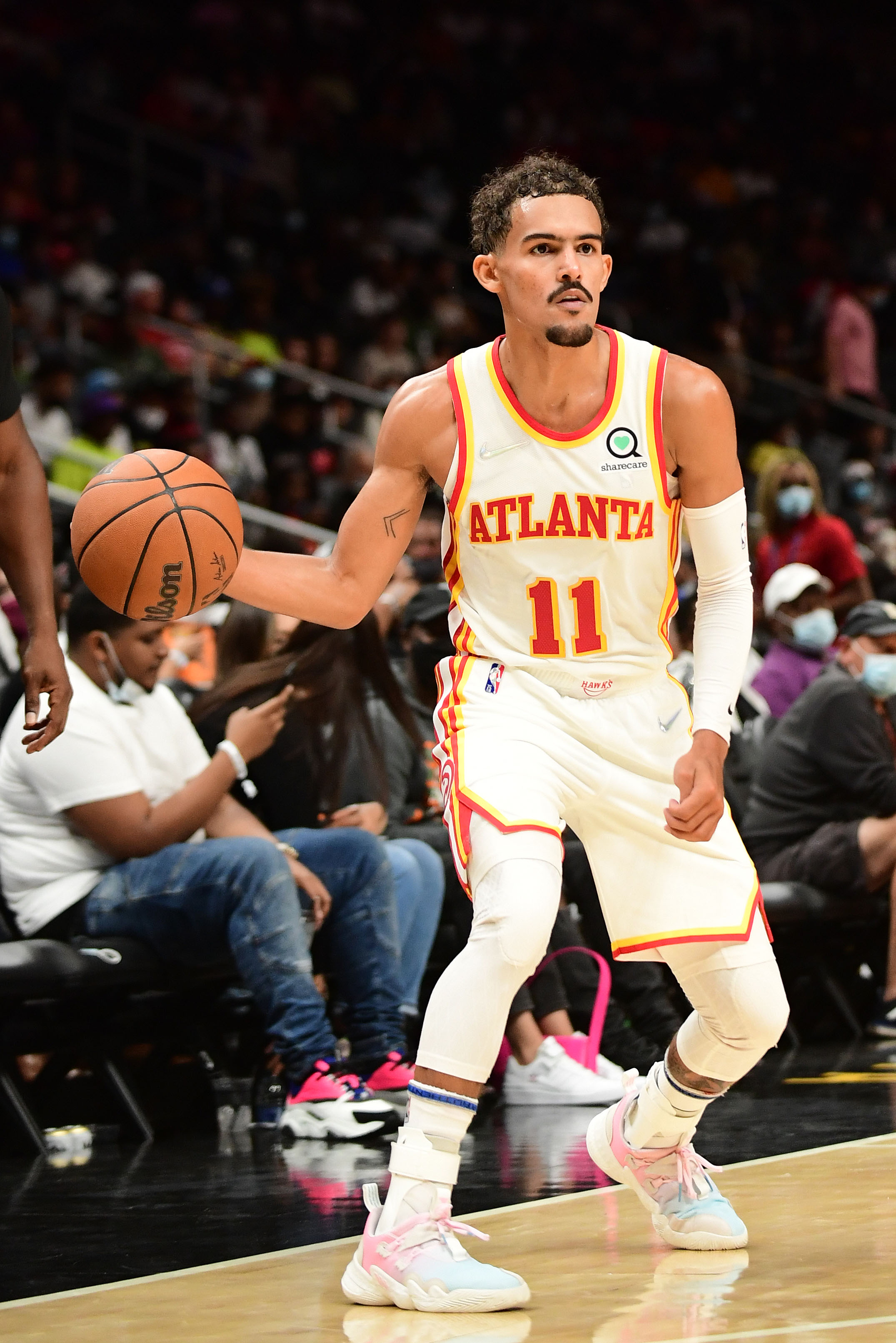 ATLANTA, GA - OCTOBER 14: Trae Young #11 of the Atlanta Hawks handles the ball during a preseason game against the Miami Heat on October 14, 2021 at State Farm Arena in Atlanta, Georgia.  NOTE TO USER: User expressly acknowledges and agrees that, by downloading and/or using this Photograph, user is consenting to the terms and conditions of the Getty Images License Agreement. Mandatory Copyright Notice: Copyright 2021 NBAE (Photo by Adam Hagy/NBAE via Getty Images)