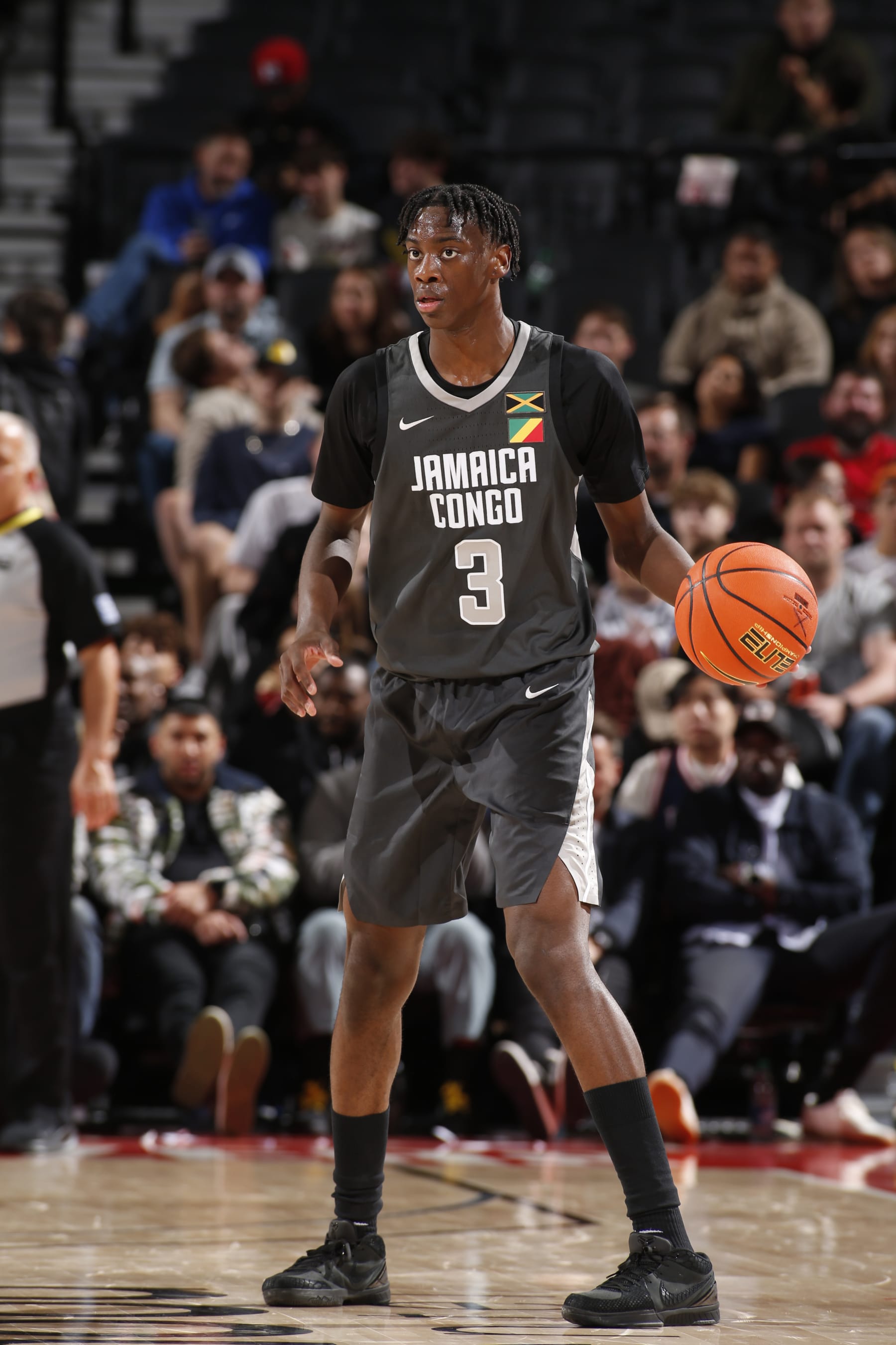 PORTLAND, OR - APRIL 13: AJ Dybantsa #3 of Team World dribbles the ball during the game against Team USA during the 2024 Nike Hoop Summit on April 13, 2024 at the Moda Center Arena in Portland, Oregon. NOTE TO USER: User expressly acknowledges and agrees that, by downloading and or using this photograph, user is consenting to the terms and conditions of the Getty Images License Agreement. Mandatory Copyright Notice: Copyright 2024 NBAE (Photo by Cameron Browne/NBAE via Getty Images)