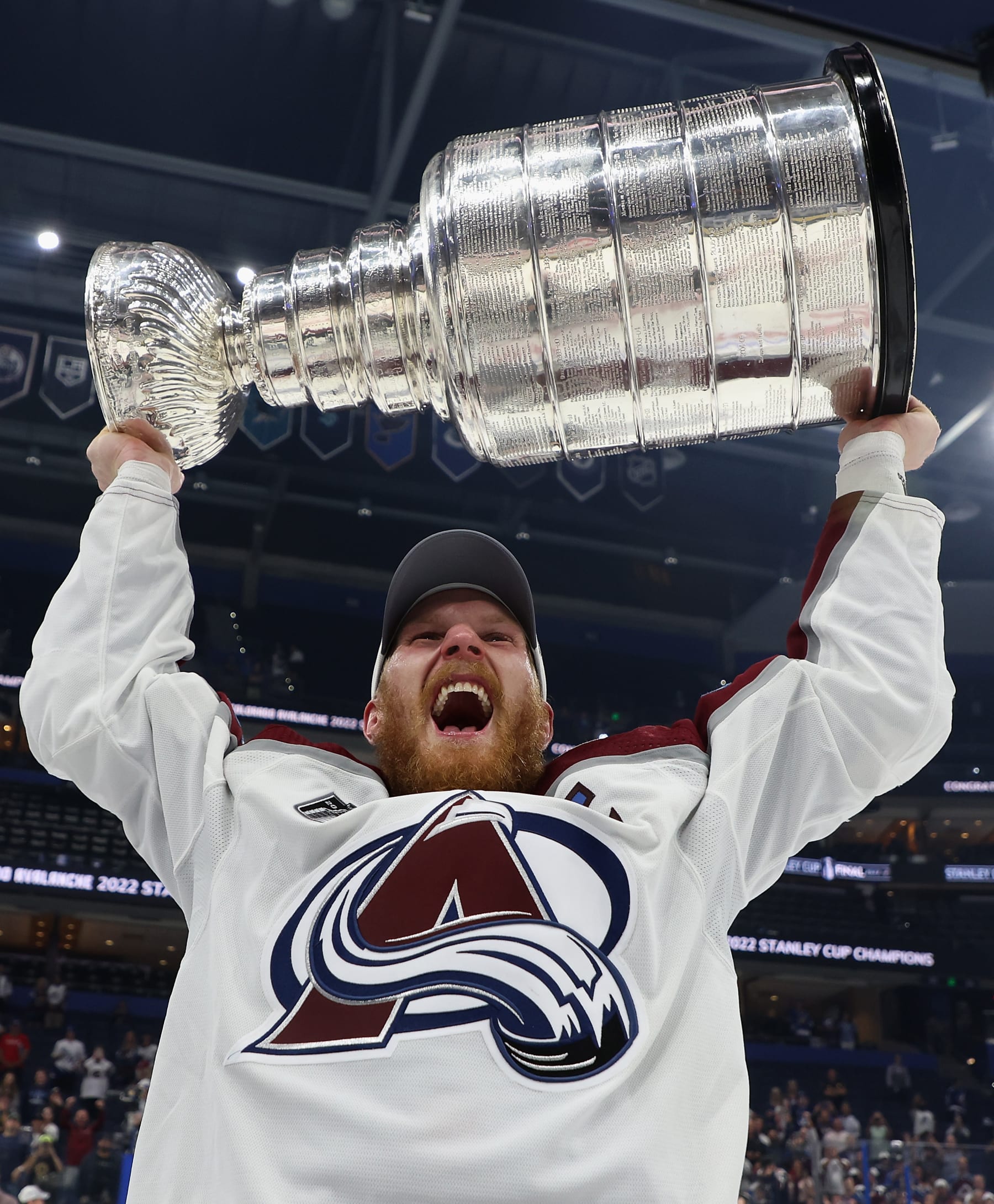 TAMPA, FLORIDA - JUNE 26:  Gabriel Landeskog #92 of the Colorado Avalanche lifts the Stanley Cup in celebration after Game Six of the 2022 NHL Stanley Cup Final at Amalie Arena on June 26, 2022 in Tampa, Florida. The Avalanche defeated the Lightning 2-1.  (Photo by Christian Petersen/Getty Images)