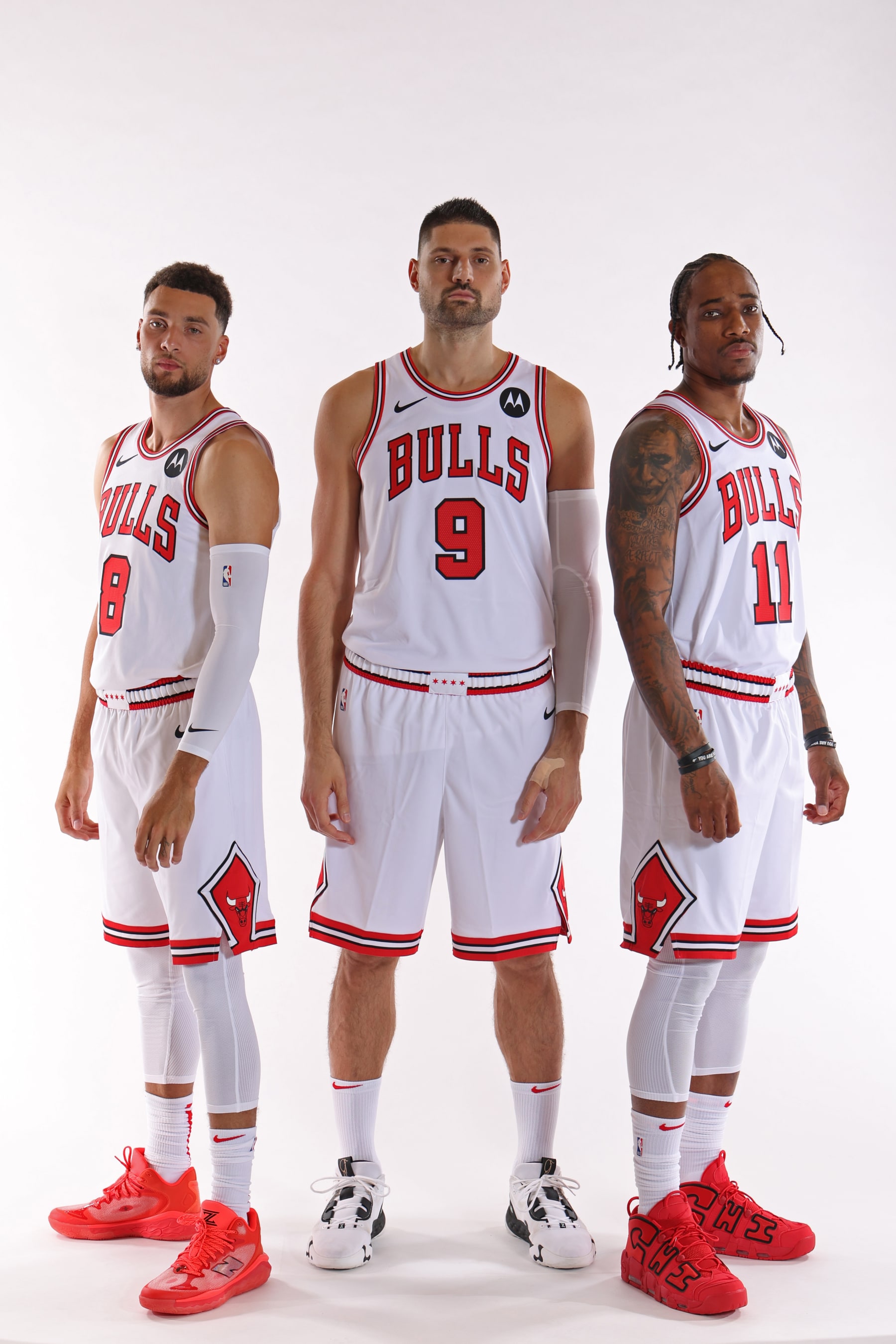 CHICAGO, IL- OCTOBER 2: Zach Lavine #8 Nikola Vucevic #9 and Demar DeRozan #11 of the Chicago Bulls poses for a portrait for Media Day at the Barclays Center in Chicago, Illinois.  NOTE TO USER: User expressly acknowledges and agrees that, by downloading and or using this photograph, User is consenting to the terms and conditions of the Getty Images License Agreement. Mandatory Copyright Notice: Copyright 2023 NBAE  (Photo by Jeff Haynes/NBAE via Getty Images)