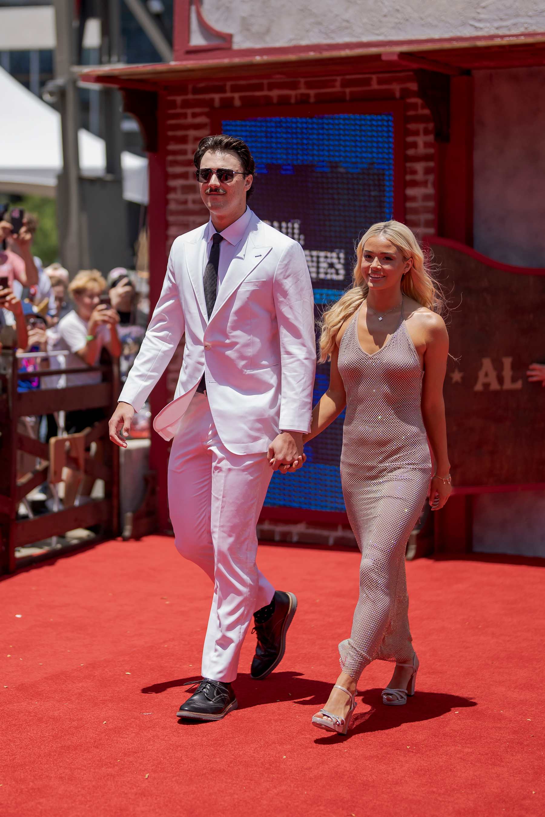 ARLINGTON, TX - JULY 16: Paul Skenes #30 of the Pittsburgh Pirates, and Livvy Dunne pose for a photo during the 2024 All-Star Red Carpet Show presented by Frutitas Agua Fresca at Globe Life Field North Plaza on Tuesday, July 16, 2024 in Arlington, Texas. (Photo by Matt Dirksen/Chicago Cubs/Getty Images)