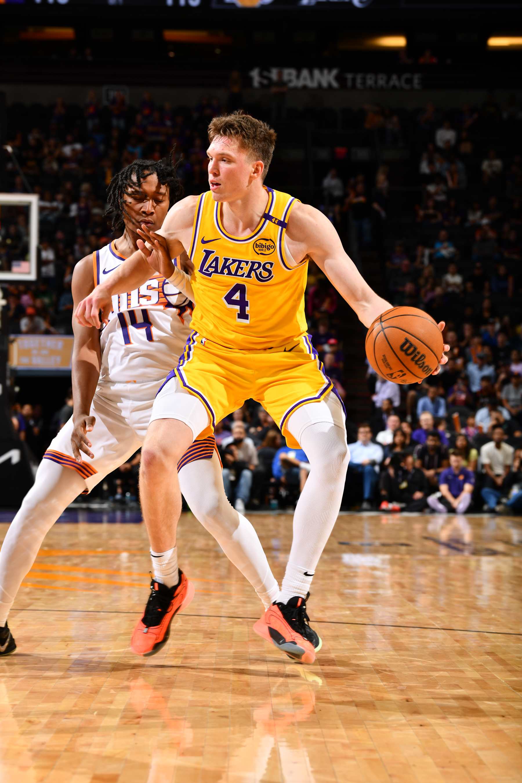 PHOENIX, AZ - OCTOBER 17: Dalton Knecht #4 of the Los Angeles Lakers handles the ball during the game against the Phoenix Suns during a NBA Preseason game on October 17, 2024 at Footprint Center in Phoenix, Arizona. NOTE TO USER: User expressly acknowledges and agrees that, by downloading and or using this photograph, user is consenting to the terms and conditions of the Getty Images License Agreement. Mandatory Copyright Notice: Copyright 2024 NBAE (Photo by Barry Gossage/NBAE via Getty Images)