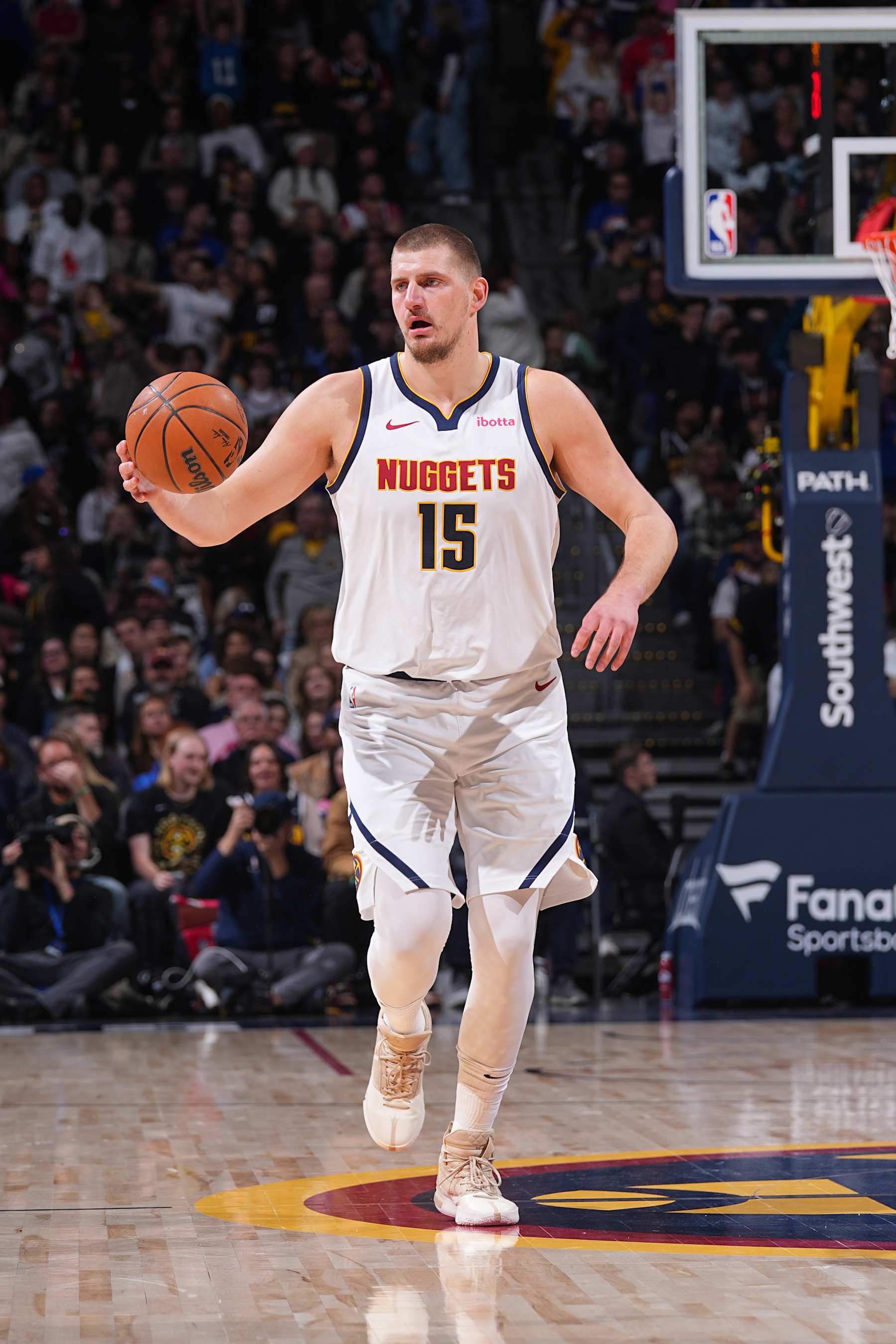 DENVER, CO - DECEMBER 27: Nikola Jokic #15 of the Denver Nuggets dribbles the ball during the game against the Cleveland Cavaliers on December 27, 2024 at Ball Arena in Denver, Colorado. NOTE TO USER: User expressly acknowledges and agrees that, by downloading and/or using this Photograph, user is consenting to the terms and conditions of the Getty Images License Agreement. Mandatory Copyright Notice: Copyright 2024 NBAE (Photo by Bart Young/NBAE via Getty Images)