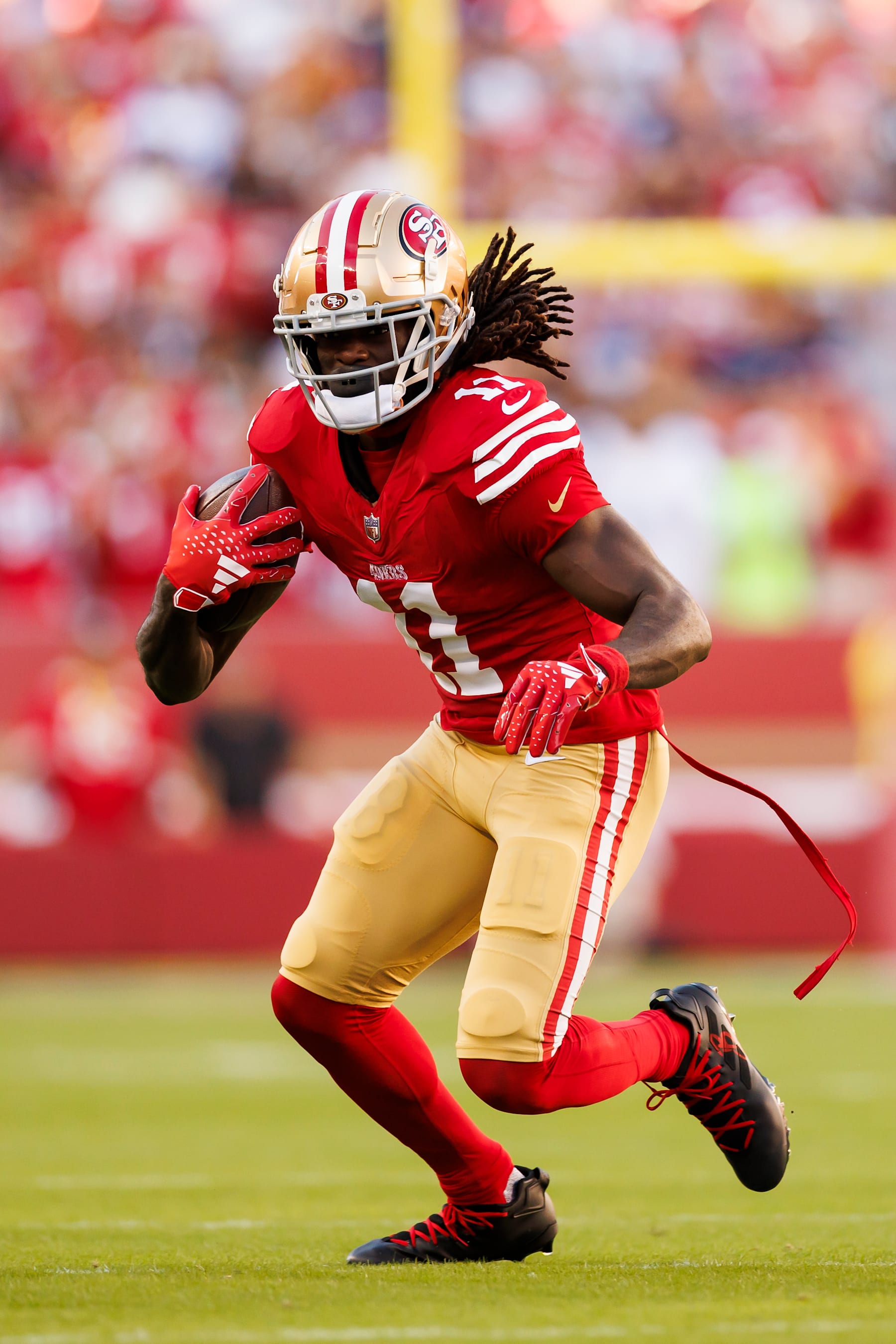 SANTA CLARA, CALIFORNIA - OCTOBER 08: Brandon Aiyuk #11 of the San Francisco 49ers runs the ball after a catch during an NFL football game against the Dallas Cowboys at Levi's Stadium on October 8, 2023 in Santa Clara, California. (Photo by Ryan Kang/Getty Images)