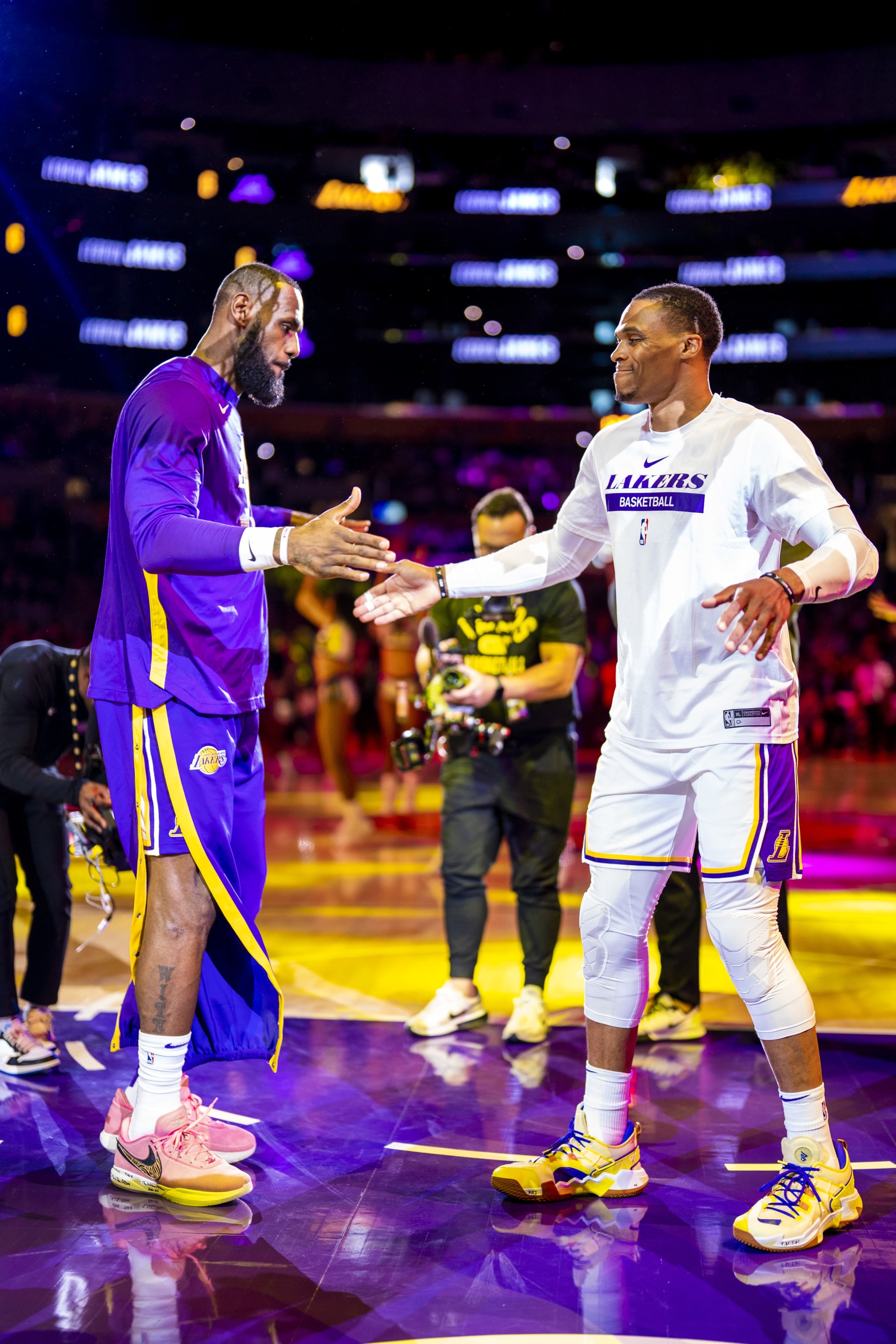 LOS ANGELES, CA - OCTOBER 23: LeBron James #6 high fives Russell Westbrook #0 of the Los Angeles Lakers before the game against the Portland Trail Blazers on October 23, 2022 at Crypto.Com Arena in Los Angeles, California. NOTE TO USER: User expressly acknowledges and agrees that, by downloading and/or using this Photograph, user is consenting to the terms and conditions of the Getty Images License Agreement. Mandatory Copyright Notice: Copyright 2022 NBAE (Photo by Tyler Ross/NBAE via Getty Images)