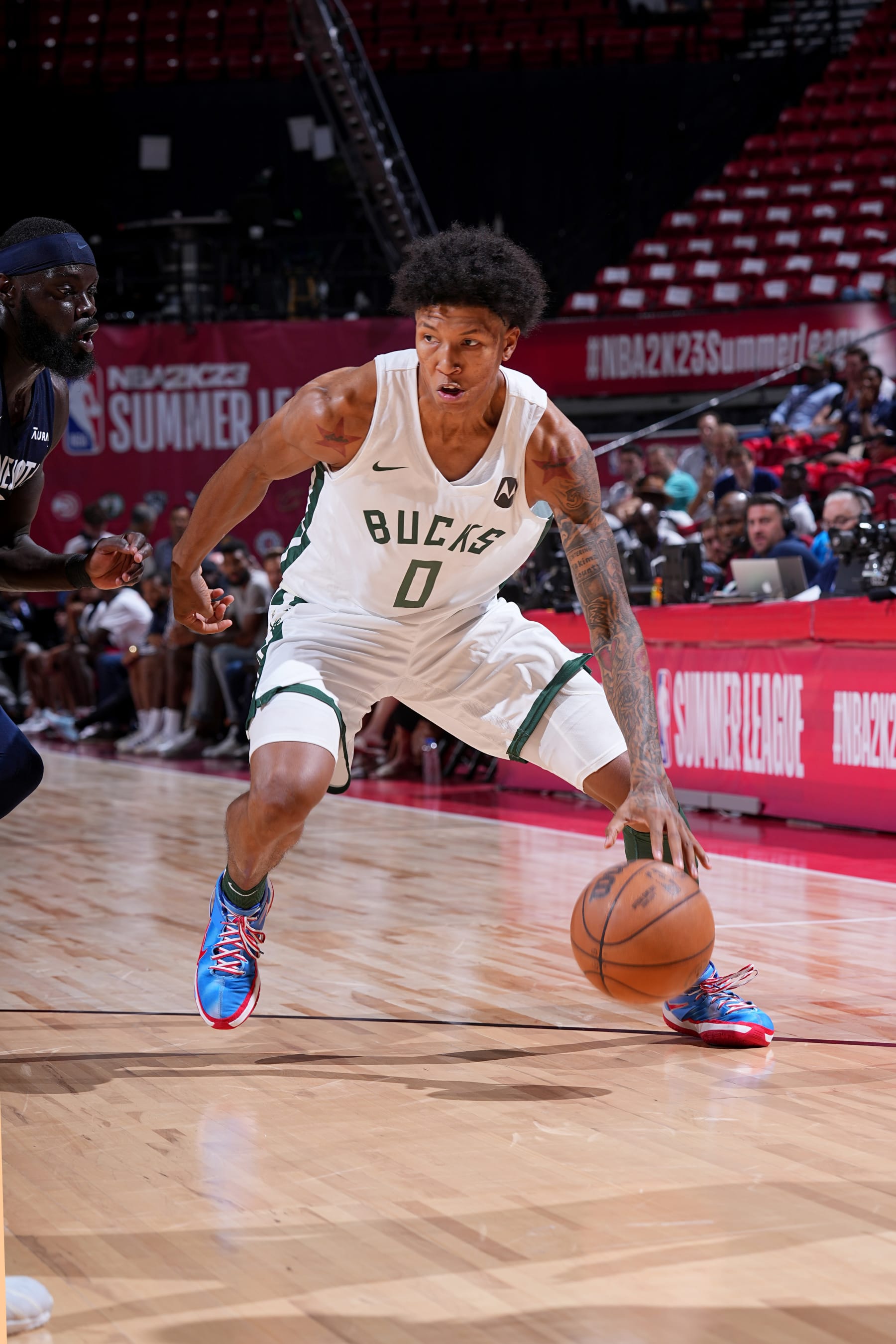 LAS VEGAS, NV - JULY 13: MarJon Beauchamp #0 of the Milwaukee Bucks handles the ball against the Minnesota Timberwolves during the 2022 Las Vegas Summer League on July 13, 2022 at the Thomas & Mack Center in Las Vegas, Nevada NOTE TO USER: User expressly acknowledges and agrees that, by downloading and/or using this Photograph, user is consenting to the terms and conditions of the Getty Images License Agreement. Mandatory Copyright Notice: Copyright 2022 NBAE (Photo by Bart Young/NBAE via Getty Images)