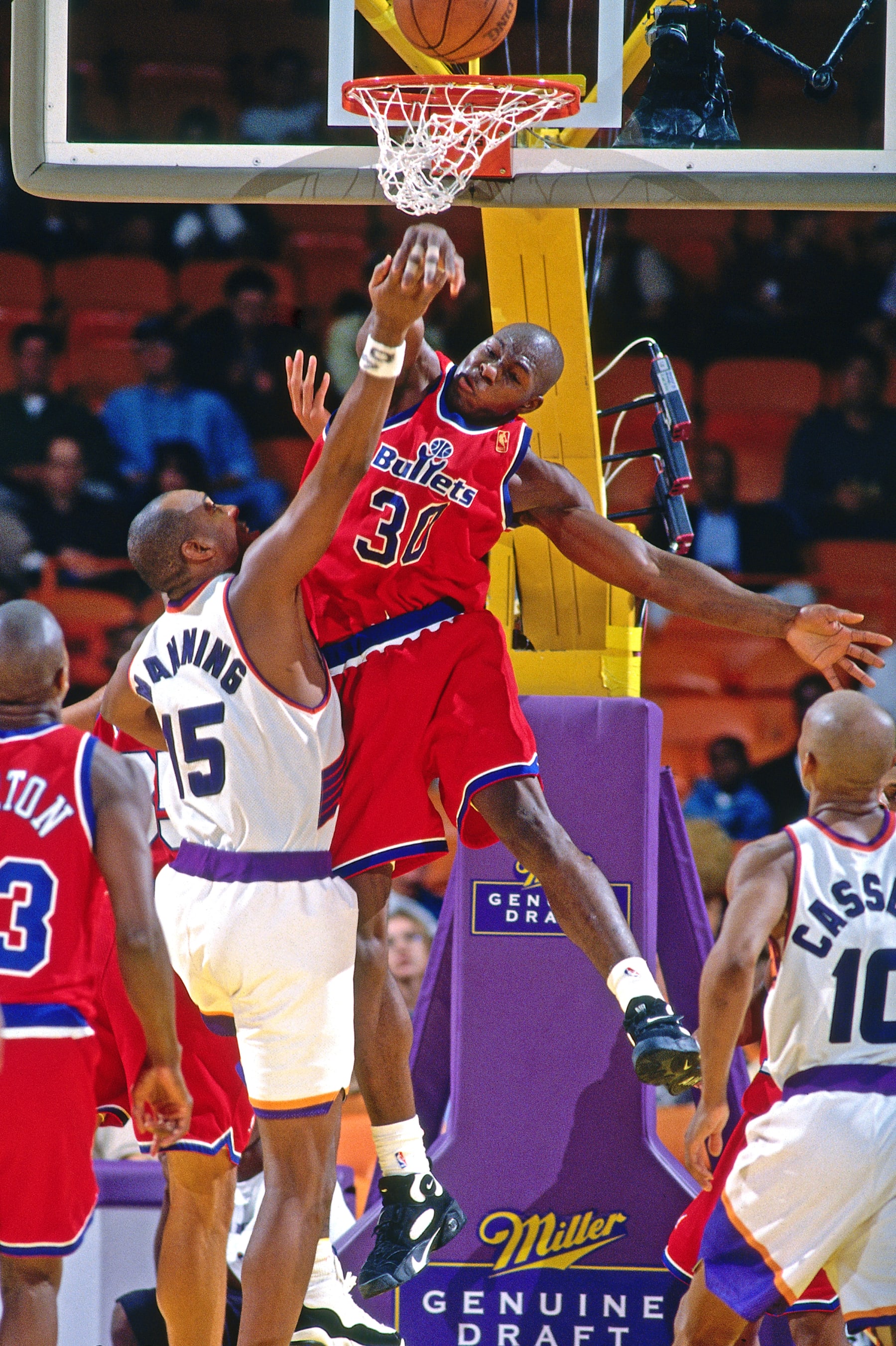 INGLEWOOD, CA - OCTOBER 18: Ben Wallace #30 of the Washington Bullets blocks a shot against Danny Manning #15 of the Phoenix Suns on October 18, 1996 at the Great Western Forum in Inglewood, California. NOTE TO USER: User expressly acknowledges and agrees that, by downloading and or using this Photograph, user is consenting to the terms and conditions of the Getty Images License Agreement. Mandatory Copyright Notice: Copyright 1996 NBAE (Photo by Andrew D. Bernstein/NBAE via Getty Images)