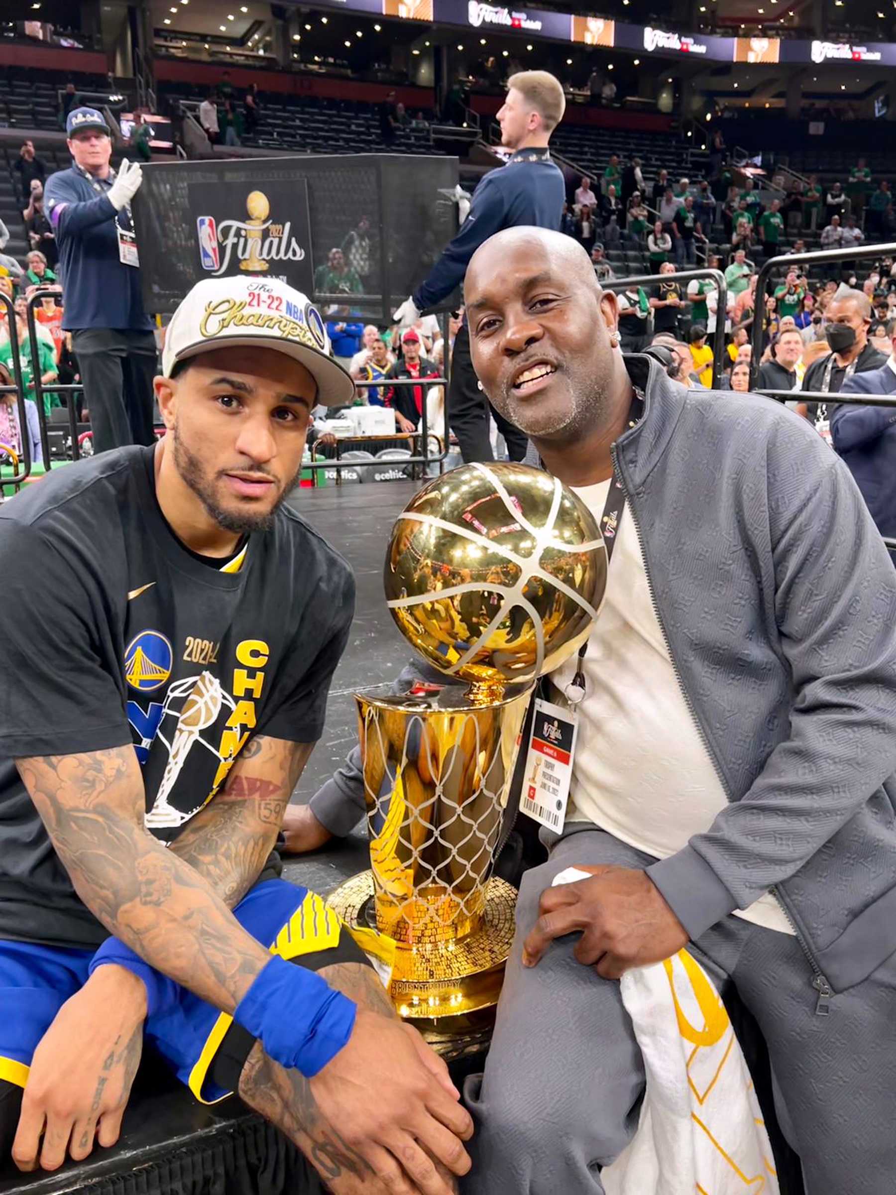 BOSTON, MA - JUNE 16: Gary Payton II #0 of the Golden State Warriors poses with the Larry OBrien Trophy with his father, Hall of Famer, Gary Payton after the game against the Boston Celtics in Game Six of the 2022 NBA Finals on June 16, 2022 at TD Garden in Boston, Massachusetts. NOTE TO USER: User expressly acknowledges and agrees that, by downloading and or using this photograph, user is consenting to the terms and conditions of Getty Images License Agreement. Mandatory Copyright Notice: Copyright 2022 NBAE (Photo by Justin DApolito/NBAE via Getty Images)