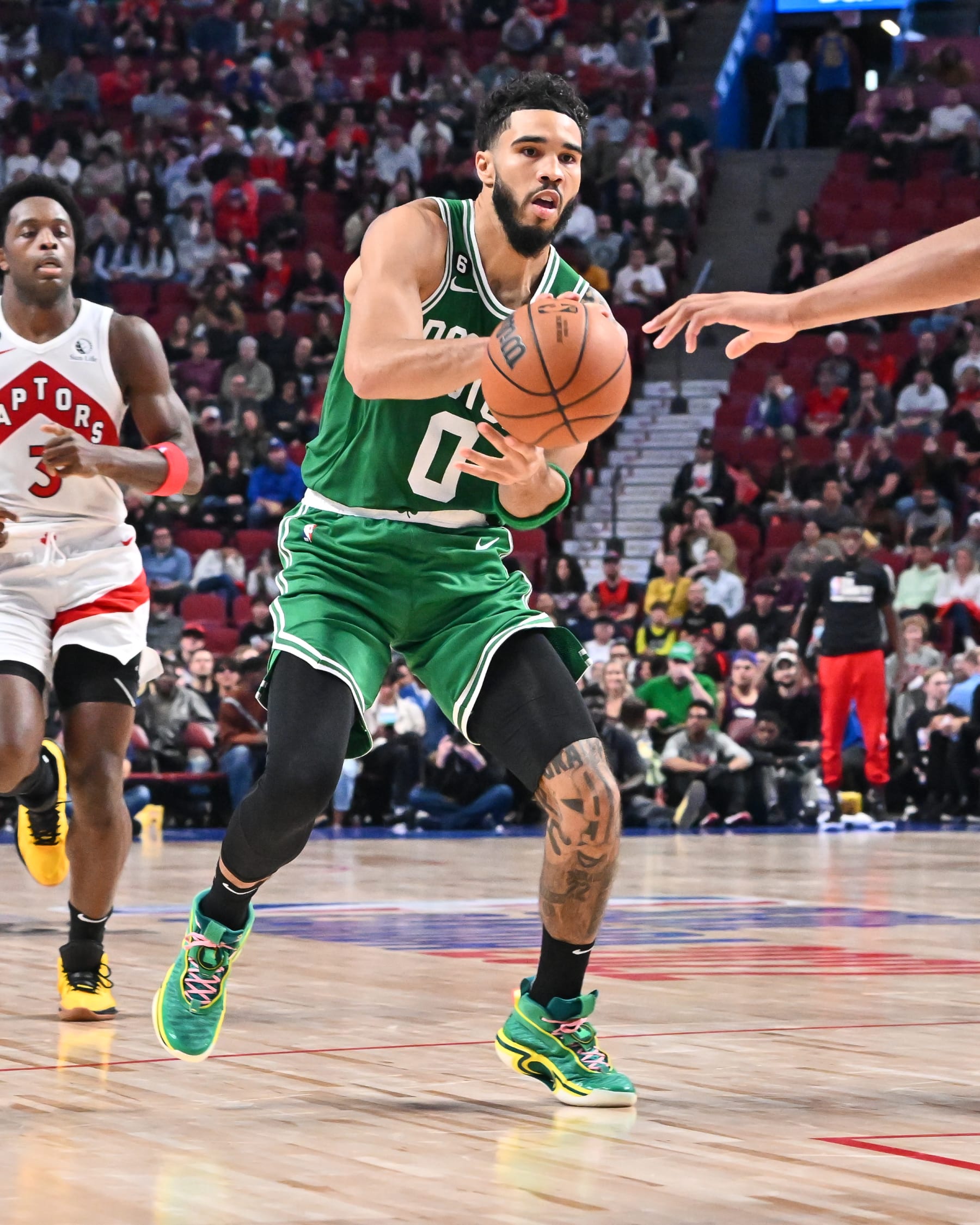 MONTREAL, CANADA - OCTOBER 14:  Jayson Tatum #0 of the Boston Celtics plays the ball against the Toronto Raptors during the second half of a preseason NBA game at Centre Bell on October 14, 2022 in Montreal, Quebec, Canada.  The Toronto Raptors defeated the Boston Celtics 137-134 in overtime.  NOTE TO USER: User expressly acknowledges and agrees that, by downloading and or using this photograph, User is consenting to the terms and conditions of the Getty Images License Agreement.  (Photo by Minas Panagiotakis/Getty Images)