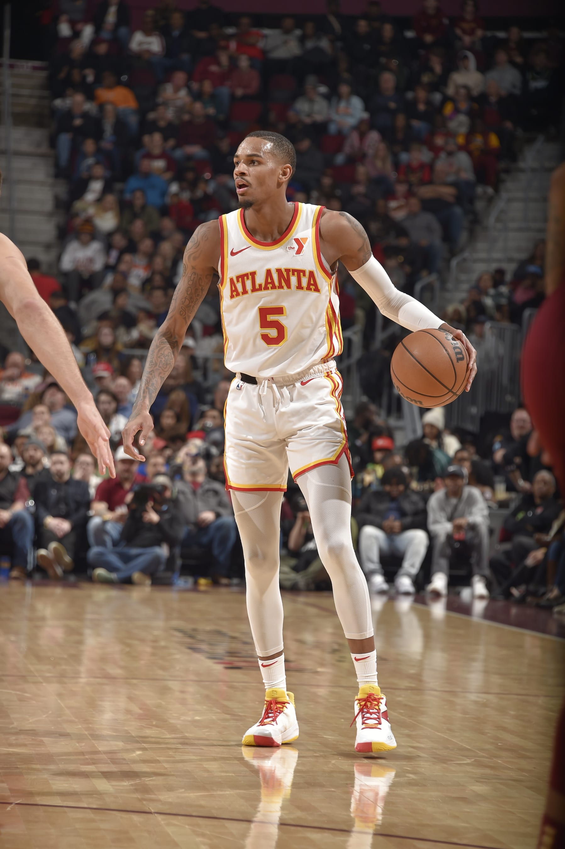 CLEVELAND, OH - DECEMBER 16:  Dejounte Murray #5 of the Atlanta Hawks handles the ball during the game  on December 16, 2023 at Rocket Mortgage FieldHouse in Cleveland, Ohio. NOTE TO USER: User expressly acknowledges and agrees that, by downloading and/or using this Photograph, user is consenting to the terms and conditions of the Getty Images License Agreement. Mandatory Copyright Notice: Copyright 2023 NBAE (Photo by David Liam Kyle/NBAE via Getty Images)