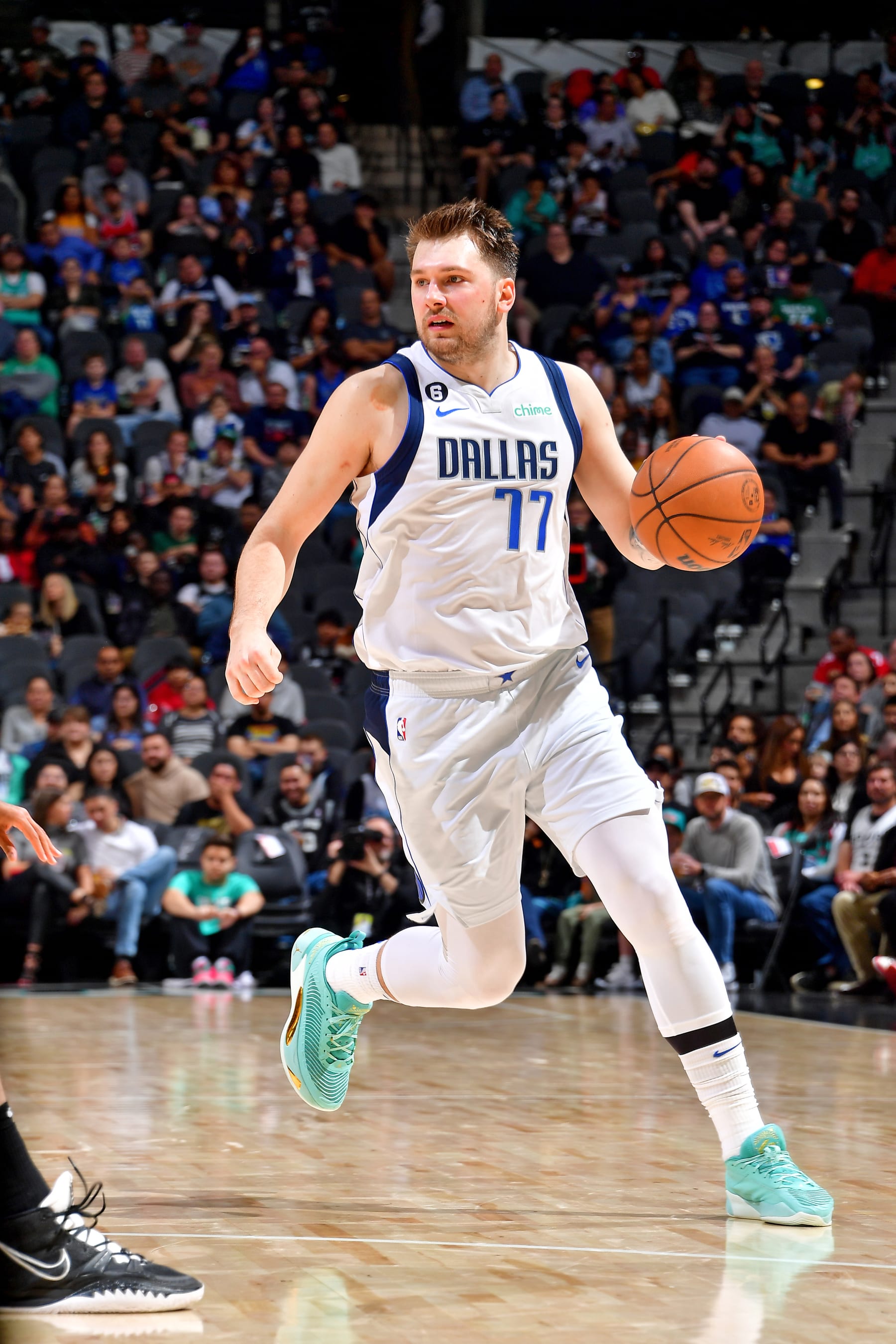 SAN ANTONIO, TX - DECEMBER 31: Luka Doncic #77 of the Dallas Mavericks dribbles the ball against the San Antonio Spurs on December 31, 2022 at the AT&T Center in San Antonio, Texas. NOTE TO USER: User expressly acknowledges and agrees that, by downloading and or using this photograph, user is consenting to the terms and conditions of the Getty Images License Agreement. Mandatory Copyright Notice: Copyright 2022 NBAE (Photos by Michael Gonzales/NBAE via Getty Images)