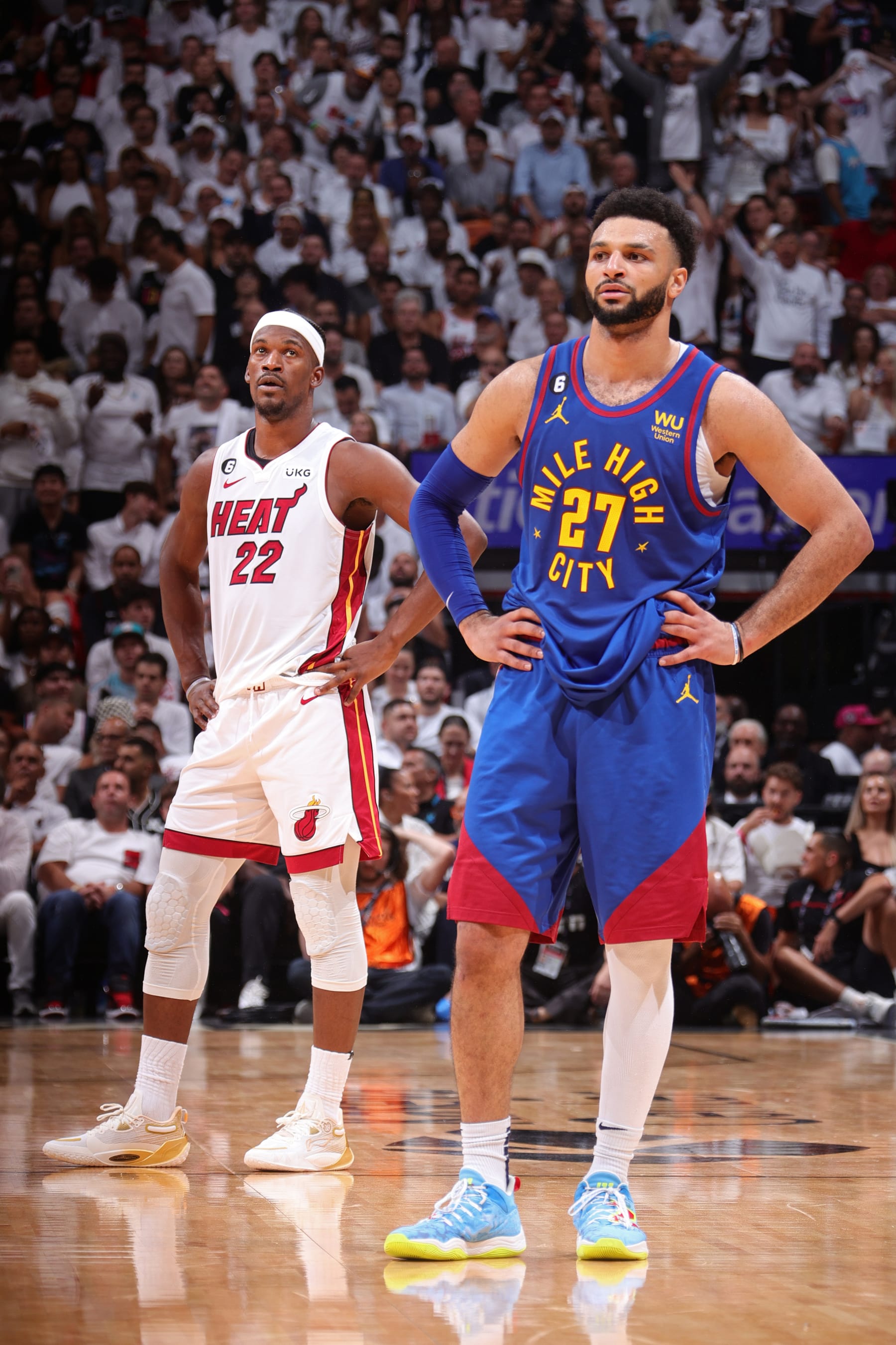 MIAMI, FL - JUNE 7: Jimmy Butler #22 of the Miami Heat and Jamal Murray #27 of the Denver Nuggets look on during Game Three of the 2023 NBA Finals on June 7, 2023 at Kaseya Center in Miami, Florida. NOTE TO USER: User expressly acknowledges and agrees that, by downloading and or using this Photograph, user is consenting to the terms and conditions of the Getty Images License Agreement. Mandatory Copyright Notice: Copyright 2023 NBAE (Photo by Nathaniel S. Butler/NBAE via Getty Images)