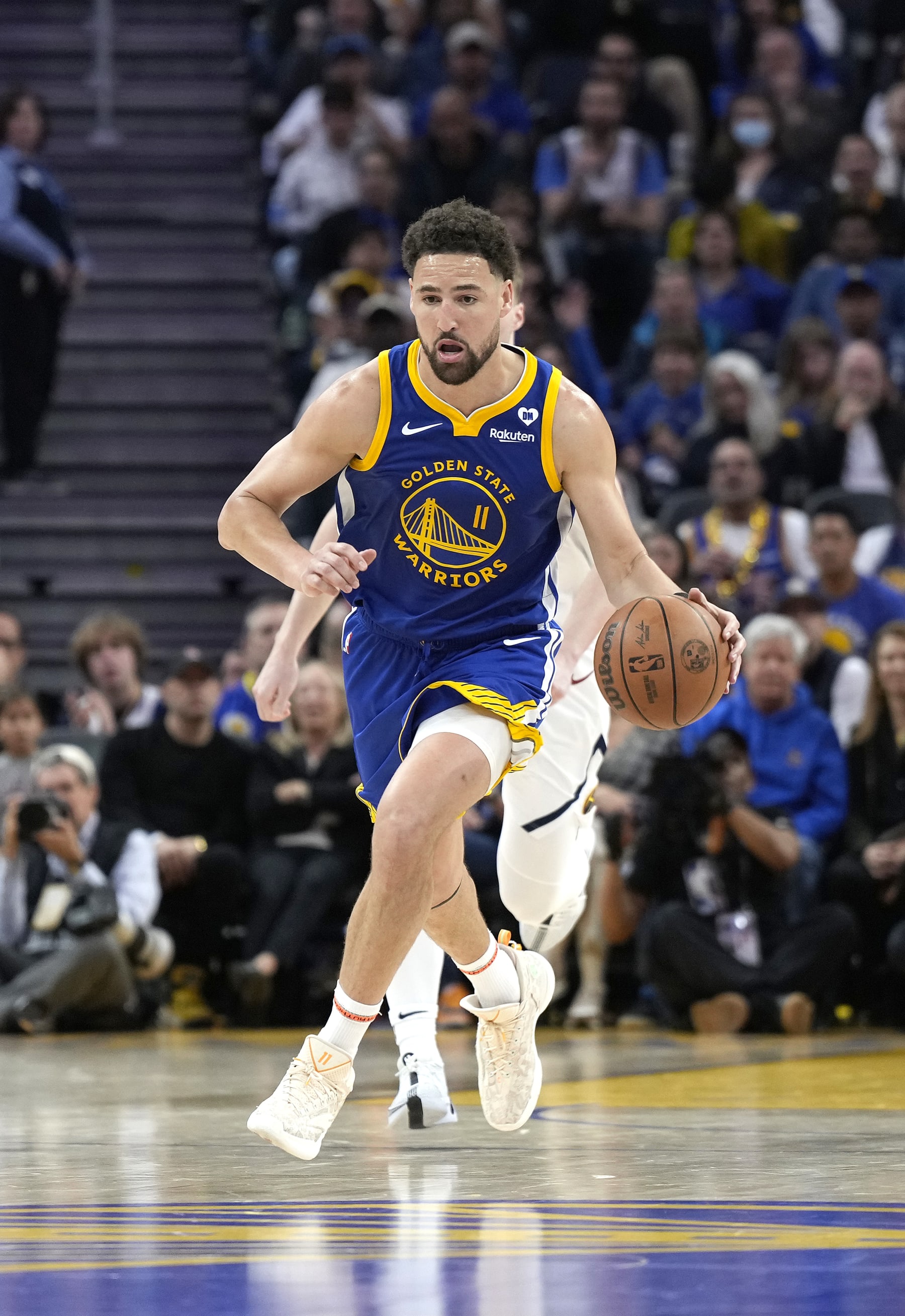 SAN FRANCISCO, CALIFORNIA - FEBRUARY 25: Klay Thompson #11 of the Golden State Warriors dribbles the ball up court against the Denver Nuggets during the third quarter of an NBA basketball game at Chase Center on February 25, 2024 in San Francisco, California. NOTE TO USER: User expressly acknowledges and agrees that, by downloading and or using this photograph, User is consenting to the terms and conditions of the Getty Images License Agreement. (Photo by Thearon W. Henderson/Getty Images)