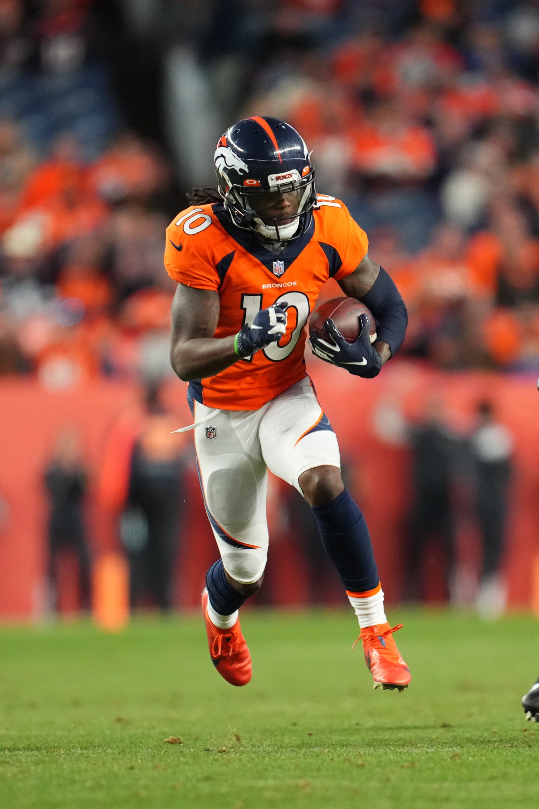 DENVER, COLORADO - DECEMBER 12: Jerry Jeudy #10 of the Denver Broncos runs the ball against the Detroit Lions during an NFL game at Empower Field At Mile High on December 12, 2021 in Denver, Colorado. (Photo by Cooper Neill/Getty Images)