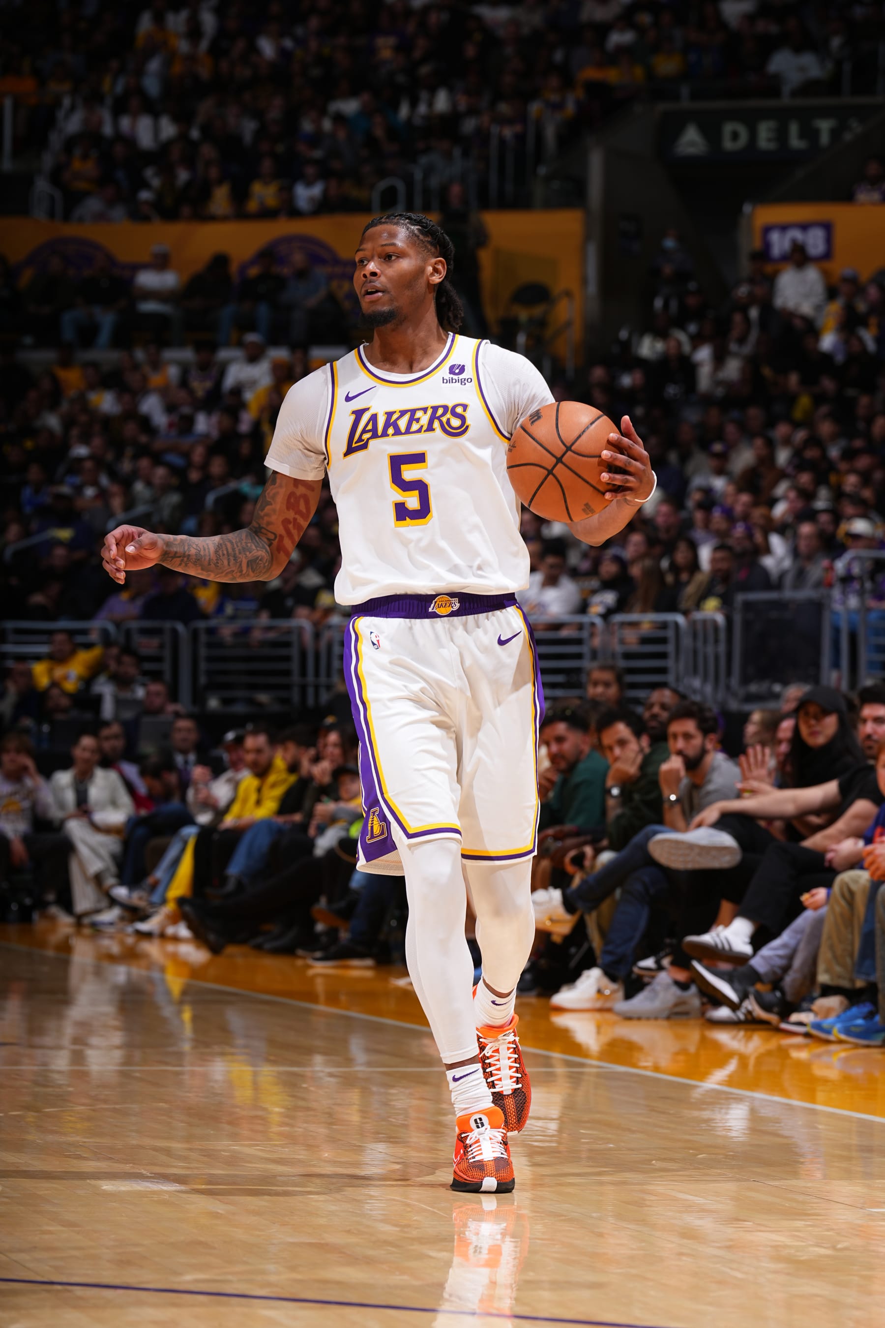 LOS ANGELES, CA - MARCH 24: Cam Reddish #5 of the Los Angeles Lakers handles the ball during the game against the Indiana Pacers on March 24, 2024 at Crypto.Com Arena in Los Angeles, California. NOTE TO USER: User expressly acknowledges and agrees that, by downloading and/or using this Photograph, user is consenting to the terms and conditions of the Getty Images License Agreement. Mandatory Copyright Notice: Copyright 2024 NBAE (Photo by Garrett Ellwood/NBAE via Getty Images)