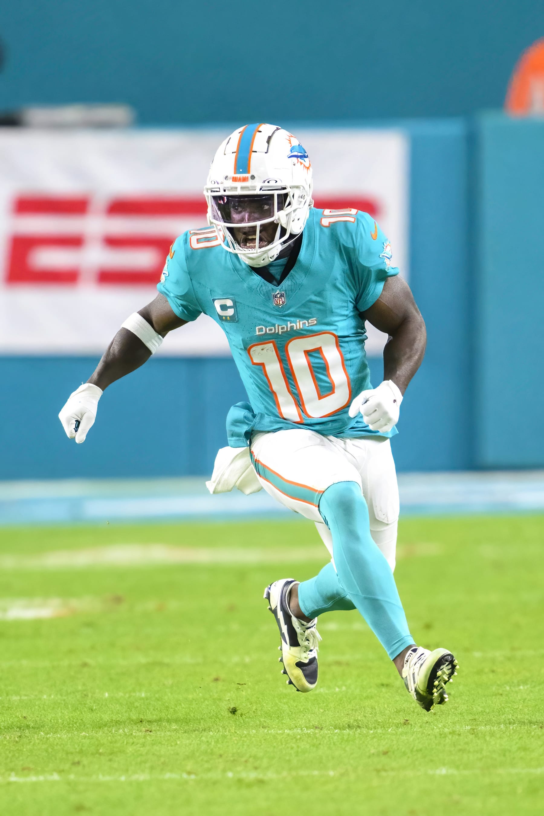 Miami Dolphins wide receiver Tyreek Hill (10) runs a play during an NFL football game against the Tennessee Titans Monday, Dec. 12, 2023, in Miami Gardens, Fla. (AP Photo/Doug Murray)