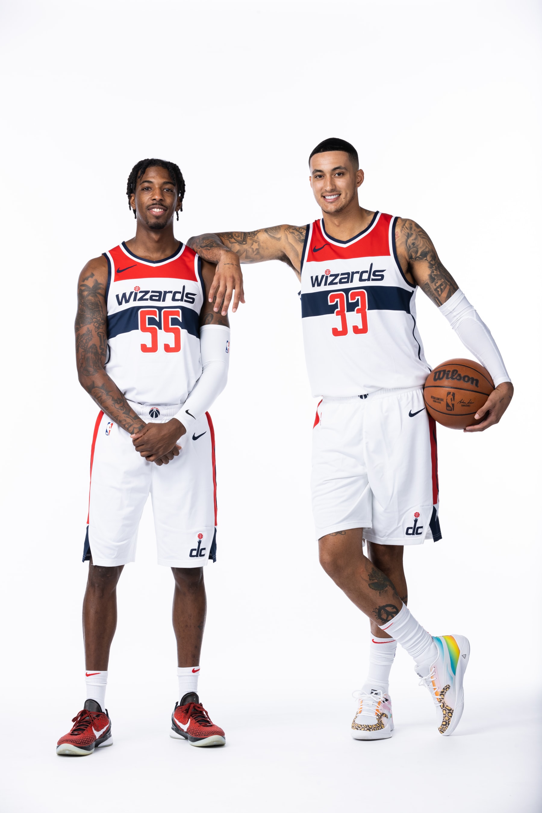 WASHINGTON, DC -  SEPTEMBER 23: Delon Wright #55 and Kyle Kuzma #33 of the Washington Wizards pose for a portrait during NBA Media Day on September 23, 2022 at Entertainment and Sports Arena in Washington, DC. NOTE TO USER: User expressly acknowledges and agrees that, by downloading and or using this Photograph, user is consenting to the terms and conditions of the Getty Images License Agreement. Mandatory Copyright Notice: Copyright 2022 NBAE (Photo by Stephen Gosling/NBAE via Getty Images)