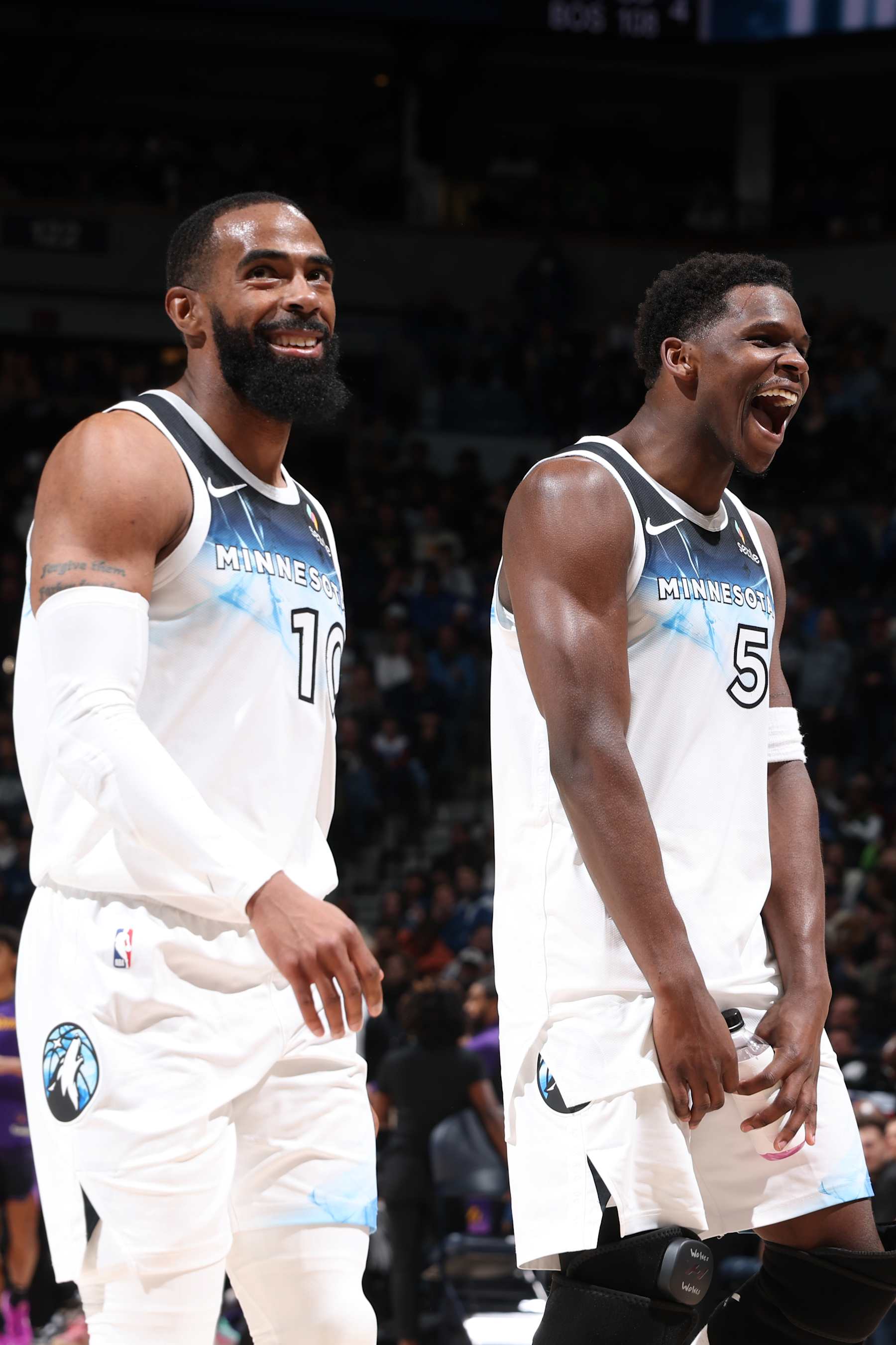 MINNEAPOLIS, MN -  DECEMBER 2: Mike Conley #10 and Anthony Edwards #5 of the Minnesota Timberwolves celebrate during the game against the Los Angeles Lakers on December 2, 2024 at Target Center in Minneapolis, Minnesota. NOTE TO USER: User expressly acknowledges and agrees that, by downloading and or using this Photograph, user is consenting to the terms and conditions of the Getty Images License Agreement. Mandatory Copyright Notice: Copyright 2024 NBAE (Photo by David Sherman/NBAE via Getty Images)
