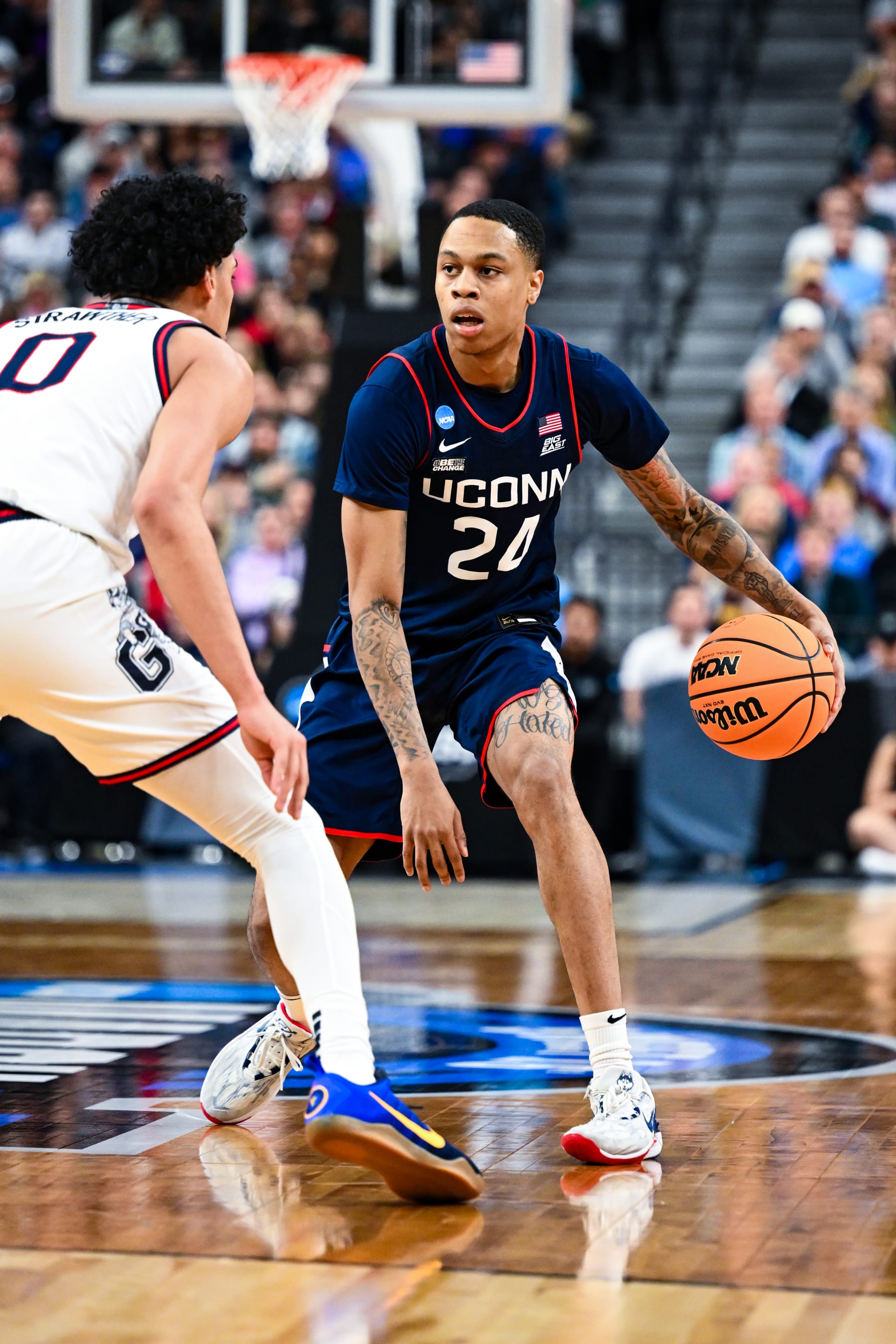 LAS VEGAS, NV - MARCH 25: Jordan Hawkins #24 of the Connecticut Huskies handles the ball against Julian Strawther #0 of the Gonzaga Bulldogs during the Elite Eight round of the 2023 NCAA Men's Basketball Tournament held at T-Mobile Arena on March 25, 2023 in Las Vegas, Nevada. (Photo by Brett Wilhelm/NCAA Photos via Getty Images)