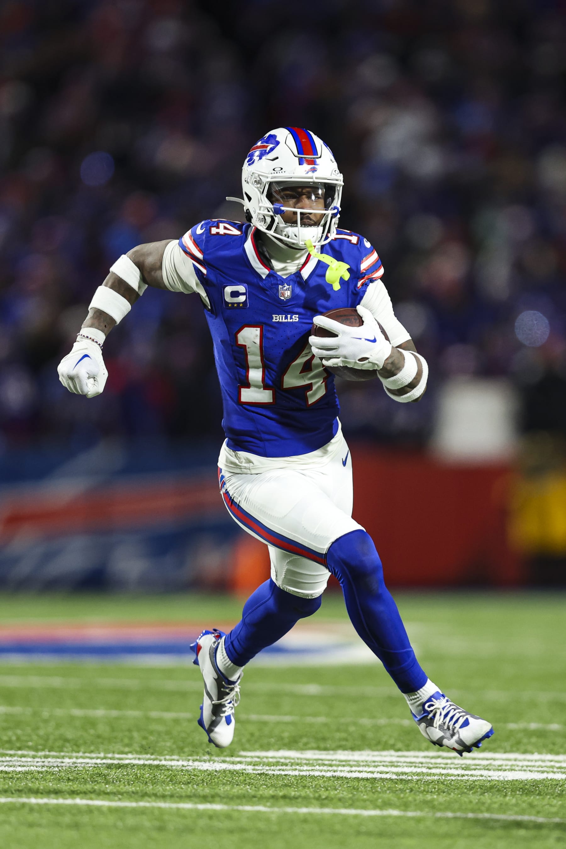 ORCHARD PARK, NY - JANUARY 21: Stefon Diggs #14 of the Buffalo Bills runs the ball during an NFL divisional round playoff football game against the Kansas City Chiefs at Highmark Stadium on January 21, 2024 in Orchard Park, New York. (Photo by Perry Knotts/Getty Images)