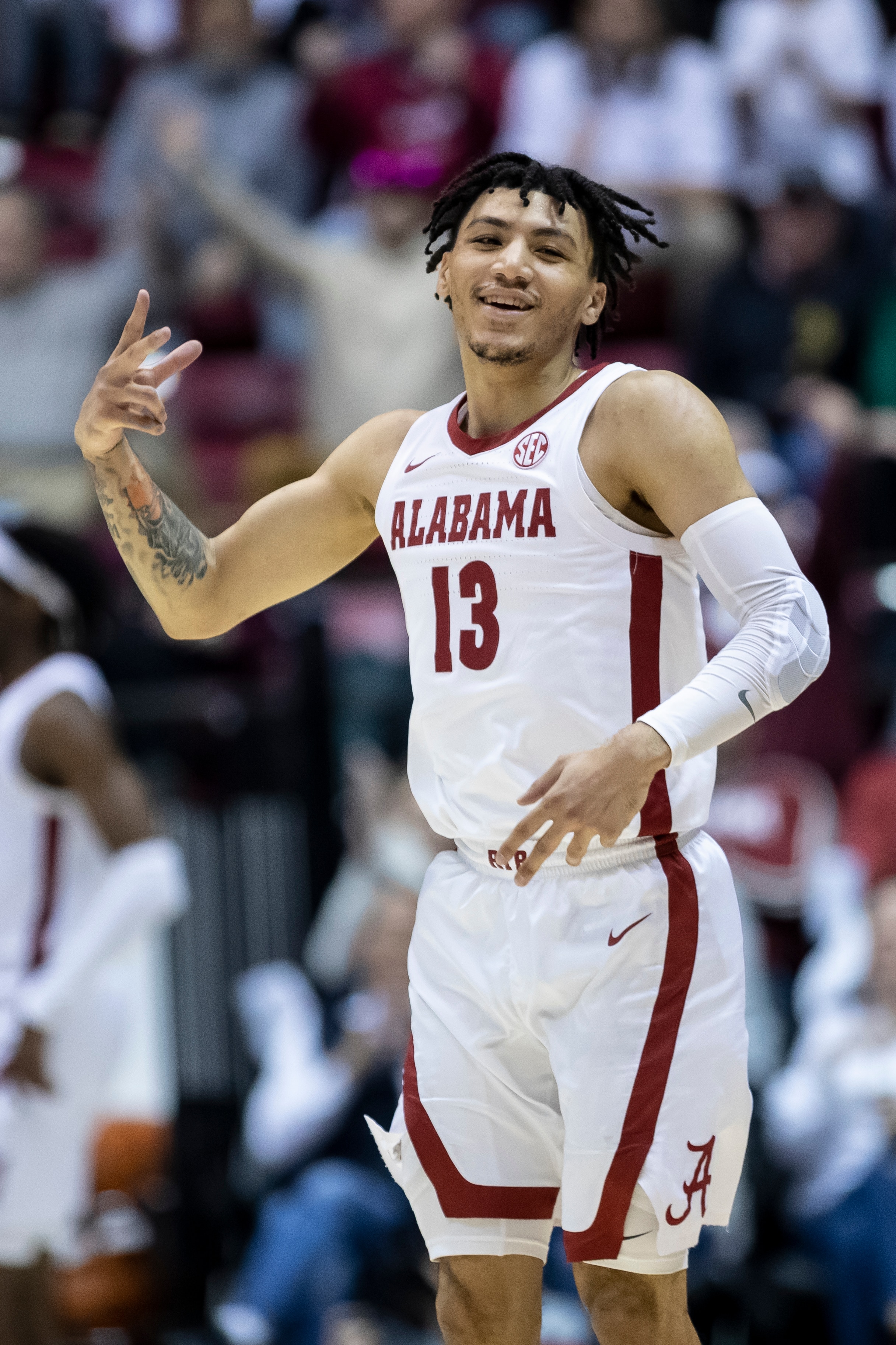 Alabama guard Jahvon Quinerly (13) cheers after hitting a 3-point shot against Baylor during the first half of an NCAA college basketball game, Saturday, Jan. 29, 2022, in Tuscaloosa, Ala. (AP Photo/Vasha Hunt)
