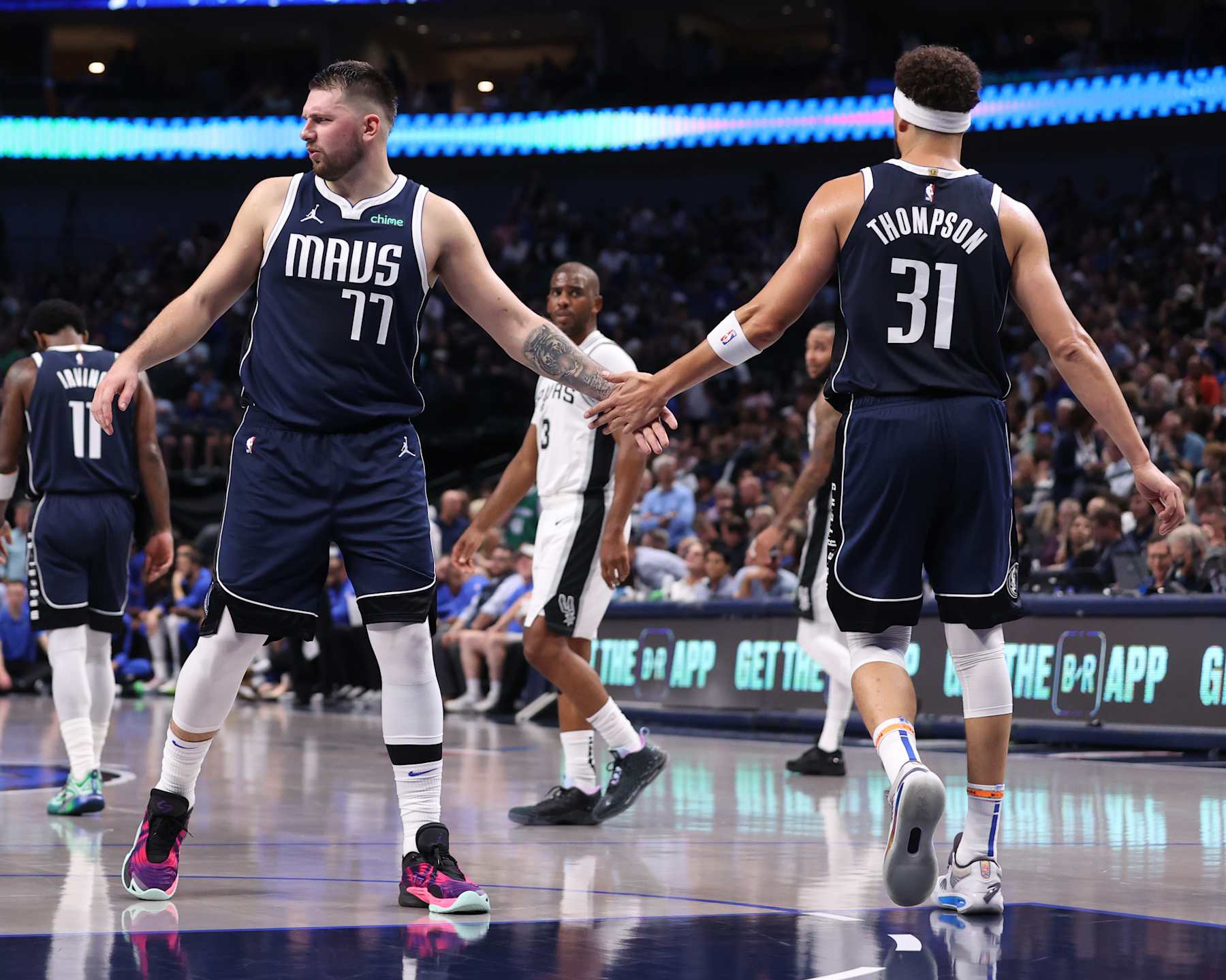 DALLAS, TX - OCTOBER 24: Luka Doncic #77 and Klay Thompson #31 of the Dallas Mavericks high five during the game against the San Antonio Spurs on October 24, 2024 at American Airlines Center in Dallas, Texas. NOTE TO USER: User expressly acknowledges and agrees that, by downloading and or using this photograph, User is consenting to the terms and conditions of the Getty Images License Agreement. Mandatory Copyright Notice: Copyright 2024 NBAE (Photo by Joe Murphy/NBAE via Getty Images)