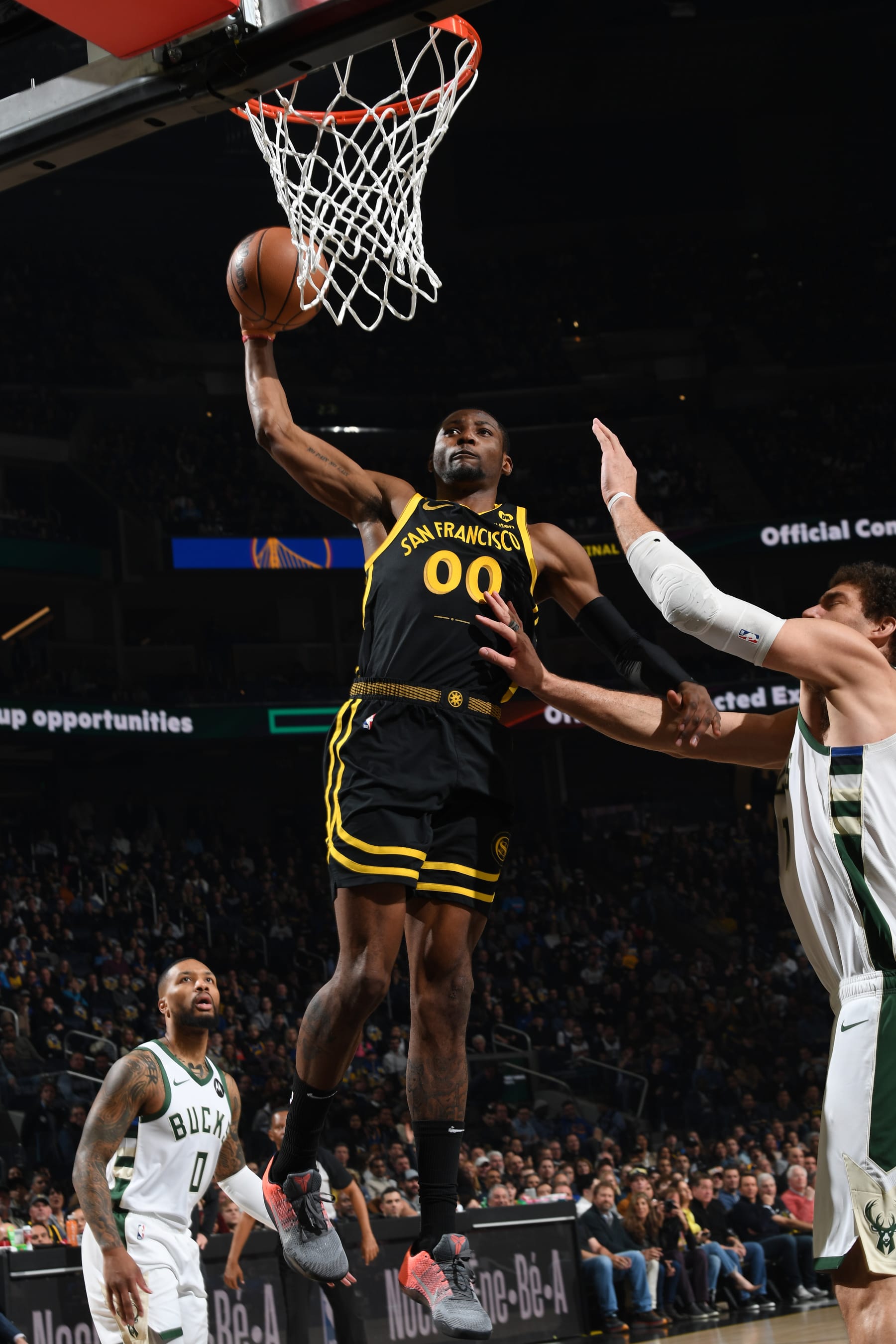 SAN FRANCISCO, CA - MARCH 6:  Jonathan Kuminga #00 of the Golden State Warriors drives to the basket during the game against the Milwaukee Bucks on MARCH 6, 2024 at Chase Center in San Francisco, California. NOTE TO USER: User expressly acknowledges and agrees that, by downloading and or using this photograph, user is consenting to the terms and conditions of Getty Images License Agreement. Mandatory Copyright Notice: Copyright 2024 NBAE (Photo by Noah Graham/NBAE via Getty Images)