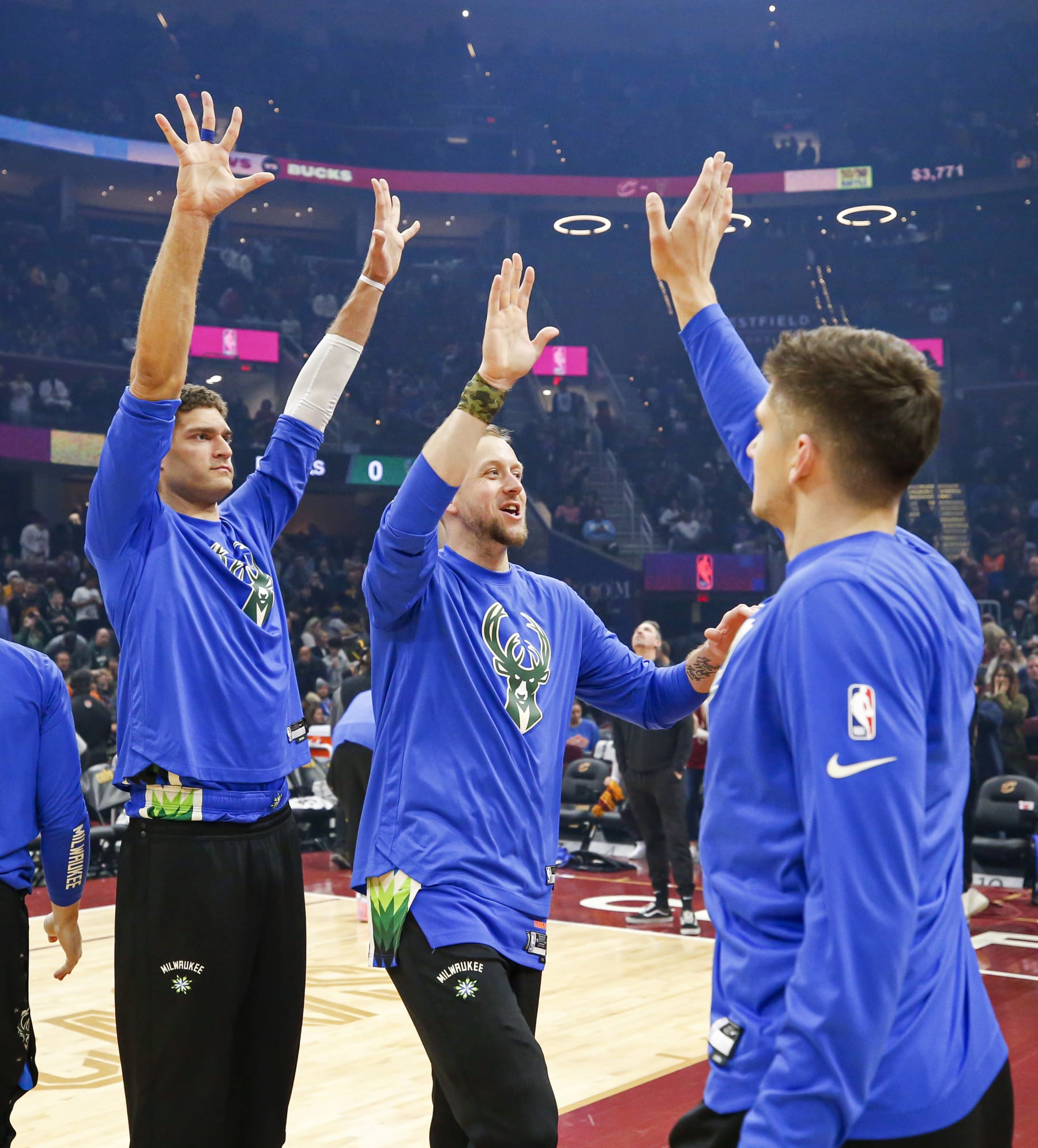 CLEVELAND, OH - DECEMBER 21: The Milwaukee Bucks  high five each other before the game against the Cleveland Cavaliers on December 21, 2022 at Rocket Mortgage FieldHouse in Cleveland, Ohio. NOTE TO USER: User expressly acknowledges and agrees that, by downloading and/or using this Photograph, user is consenting to the terms and conditions of the Getty Images License Agreement. Mandatory Copyright Notice: Copyright 2022 NBAE (Photo by Lauren Bacho/NBAE via Getty Images)