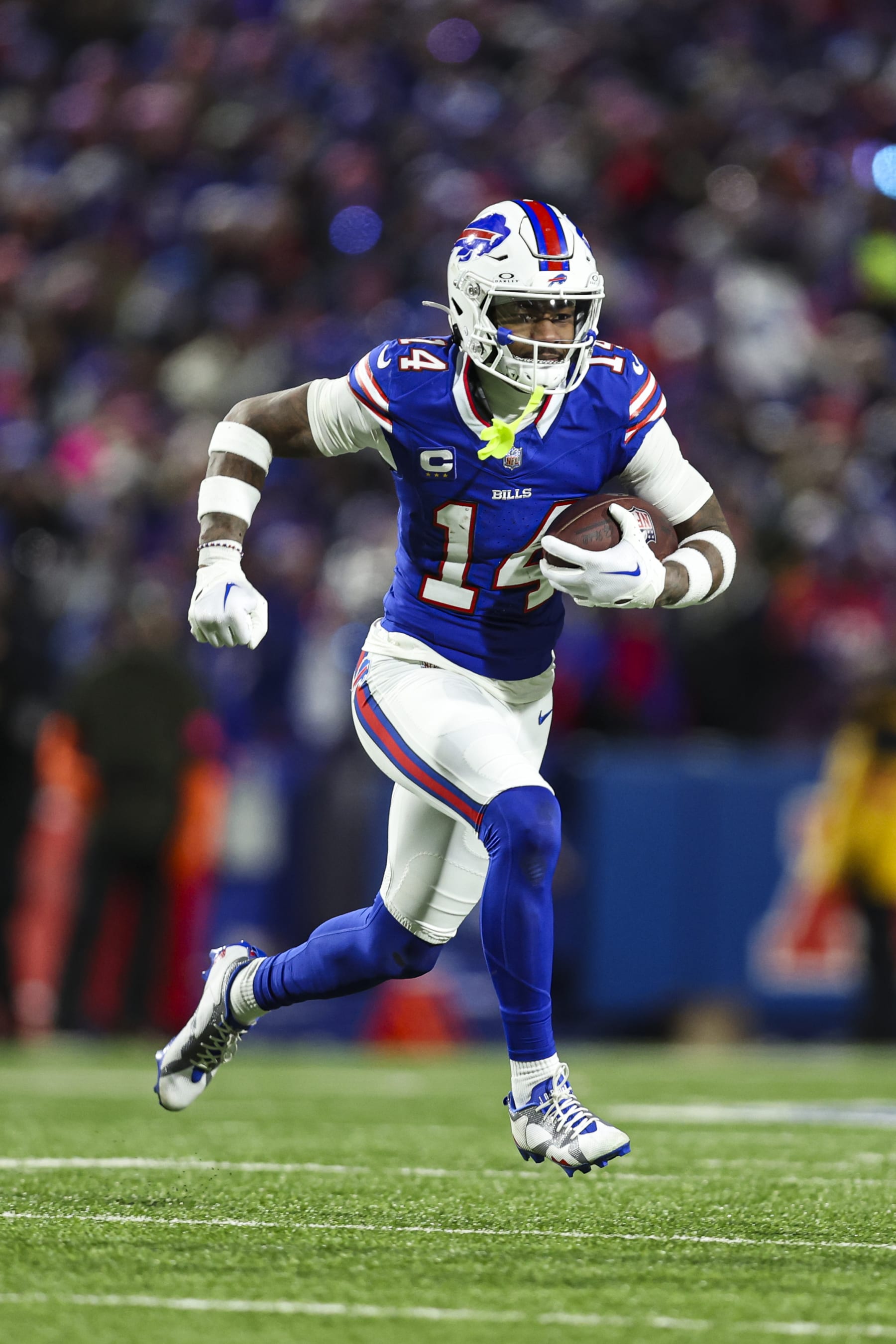 ORCHARD PARK, NY - JANUARY 21: Stefon Diggs #14 of the Buffalo Bills runs the ball during an NFL divisional round playoff football game against the Kansas City Chiefs at Highmark Stadium on January 21, 2024 in Orchard Park, New York. (Photo by Perry Knotts/Getty Images)