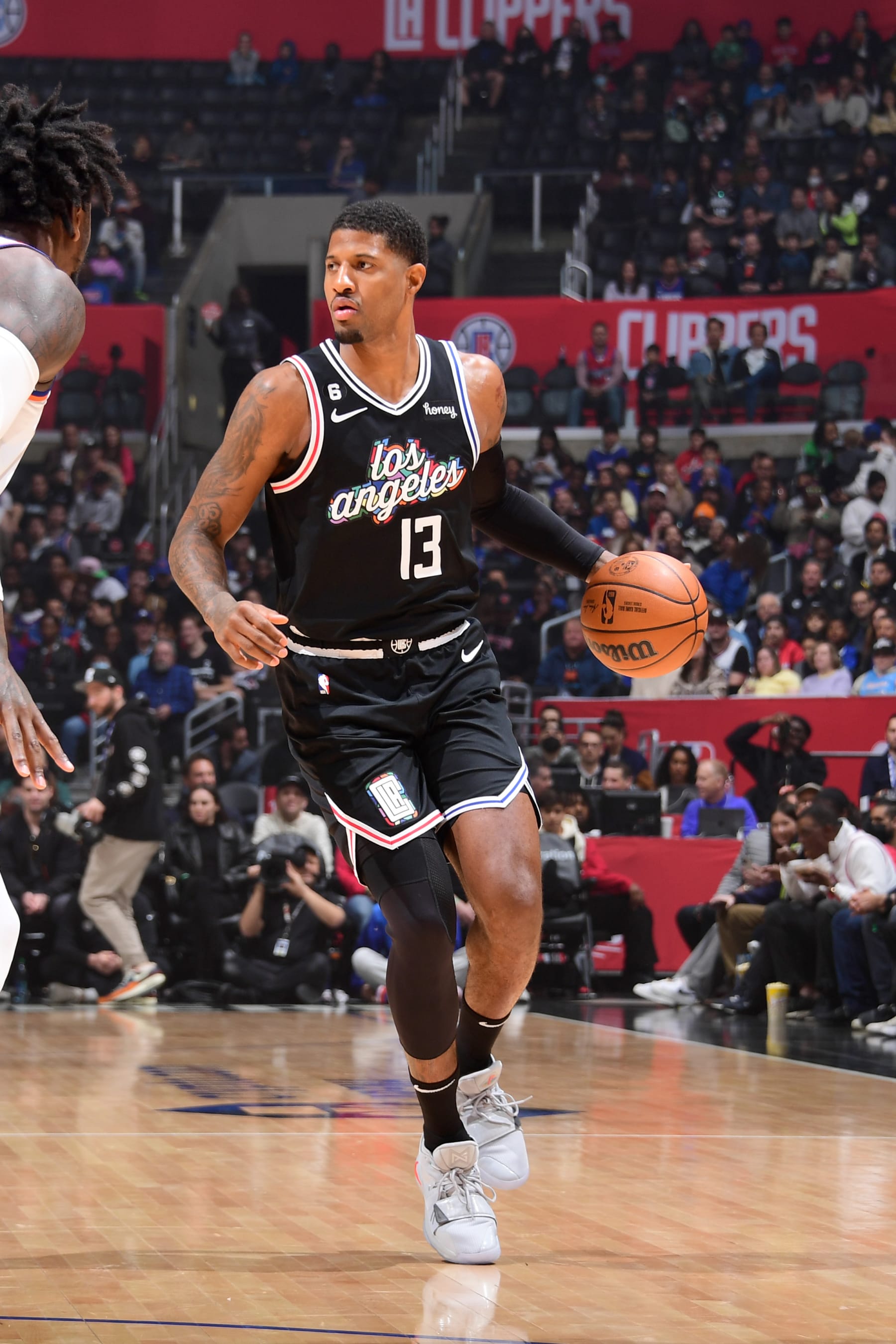 LOS ANGELES, CA - MARCH 11:  Paul George #13 of the LA Clippers dribbles the ball against the New York Knicks on March 11, 2023 at Crypto.Com Arena in Los Angeles, California. NOTE TO USER: User expressly acknowledges and agrees that, by downloading and/or using this Photograph, user is consenting to the terms and conditions of the Getty Images License Agreement. Mandatory Copyright Notice: Copyright 2023 NBAE (Photo by Adam Pantozzi/NBAE via Getty Images)