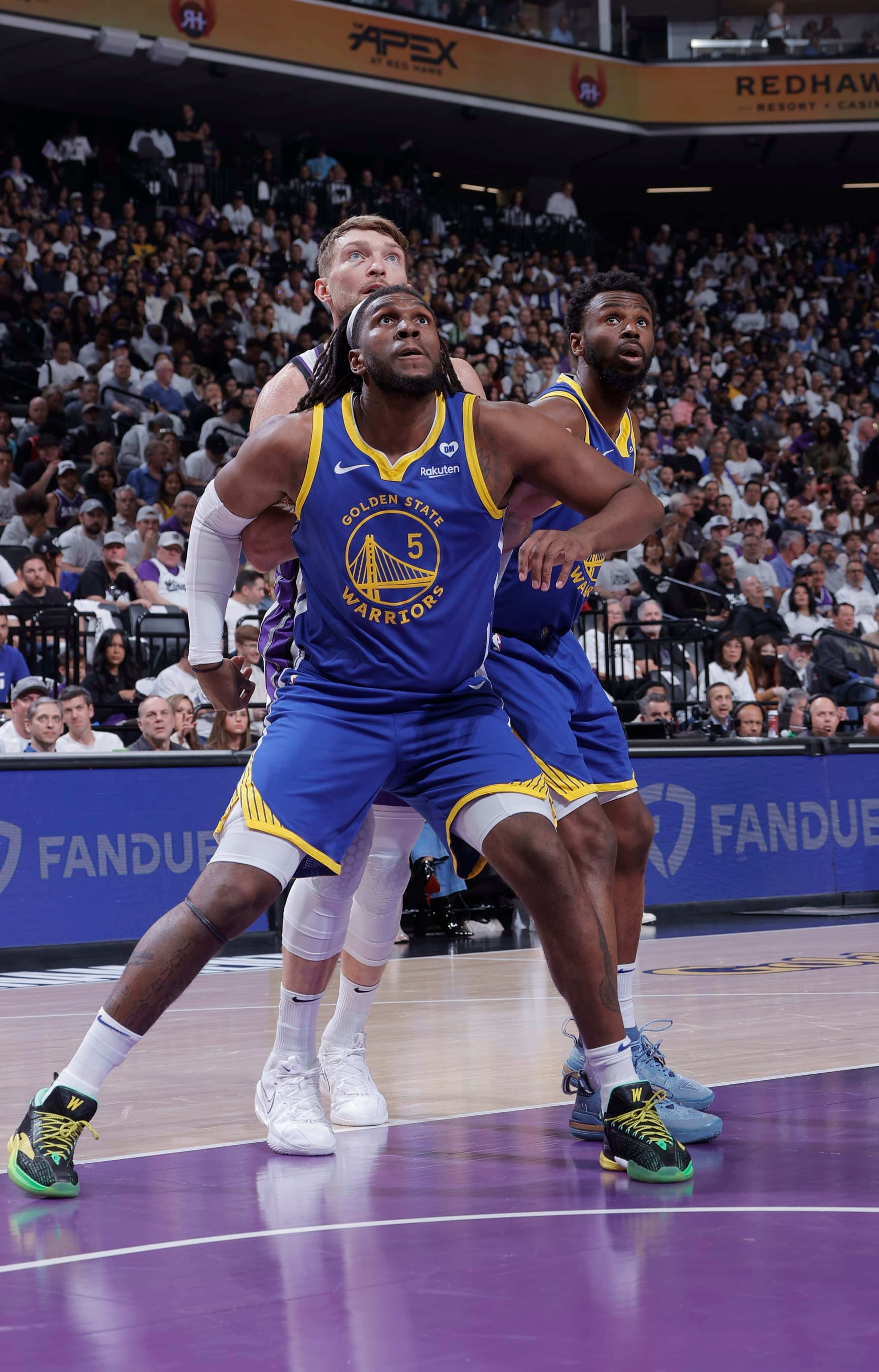 SACRAMENTO, CA - APRIL 16: Domantas Sabonis #10 of the Sacramento Kings, Kevon Looney #5 and Andrew Wiggins #22 of the Golden State Warriors wait for the rebound during the game during the 2024 Play-In Tournament on April 16, 2024 at Golden 1 Center in Sacramento, California. NOTE TO USER: User expressly acknowledges and agrees that, by downloading and or using this photograph, User is consenting to the terms and conditions of the Getty Images Agreement. Mandatory Copyright Notice: Copyright 2024 NBAE (Photo by Rocky Widner/NBAE via Getty Images)