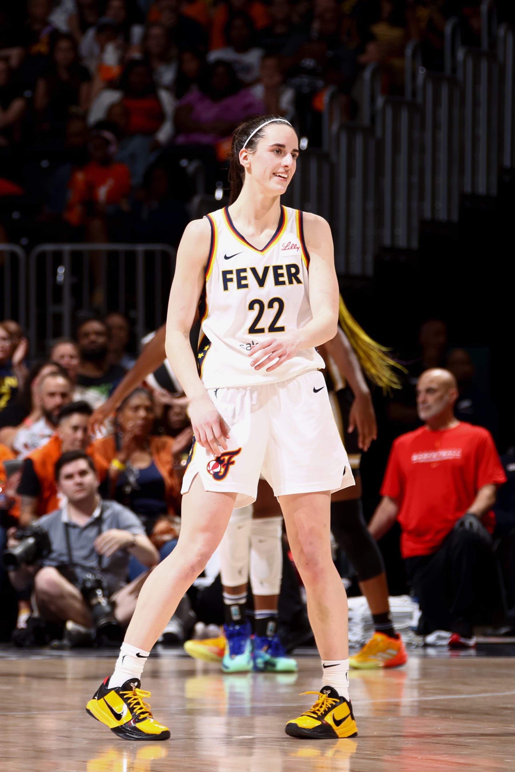 WASHINGTON, DC - JUNE 7: Caitlin Clark #22 of the Indiana Fever smiles during the game against the Washington Mystics during a 2024 Commissioner's Cup game on June 7, 2024 at Capital One Arena in Washington, DC. NOTE TO USER: User expressly acknowledges and agrees that, by downloading and or using this Photograph, user is consenting to the terms and conditions of the Getty Images License Agreement. Mandatory Copyright Notice: Copyright 2024 NBAE (Photo by Kenny Giarla/NBAE via Getty Images)